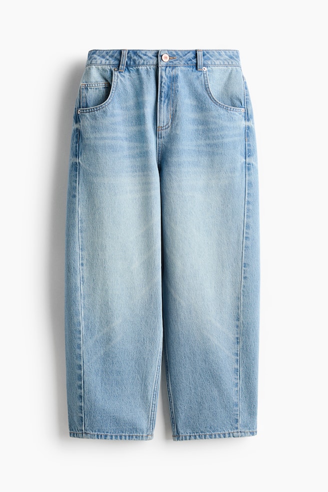 Light blue wash denim jeans are featuring a relaxed fit with a button and zipper closure, belt loops, and two curved front pockets. - 1