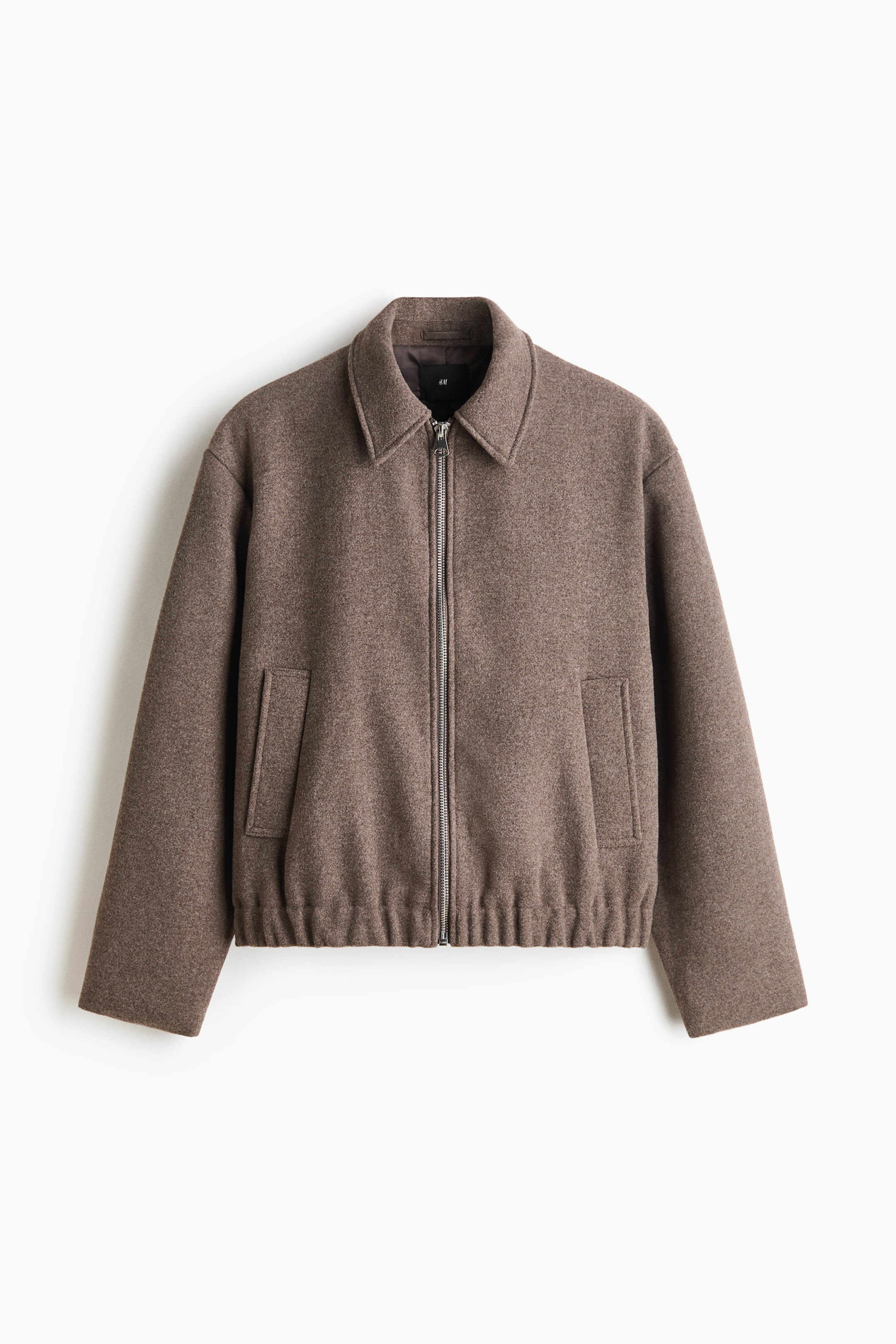 View larger image: A front-facing brown jacket in soft, brushed felted fabric features a classic point collar, a silver front zipper, and vertical welt pockets. The jacket has an elasticized, gathered hem and long, straight sleeves.