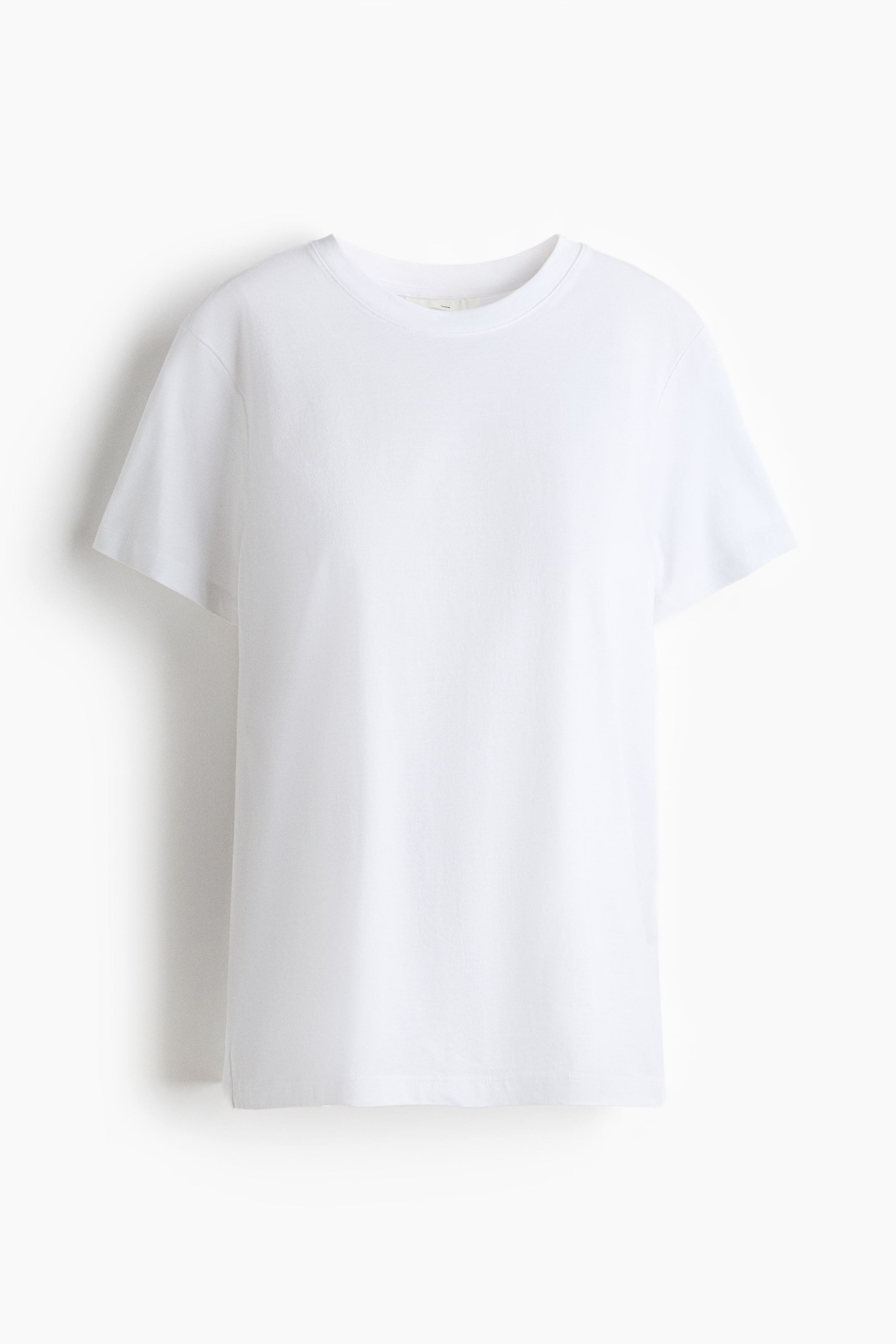 View larger image: White classic T-shirt shown from the front, featuring a rib-trimmed neckline, gently dropped shoulders, and made from soft cotton jersey.