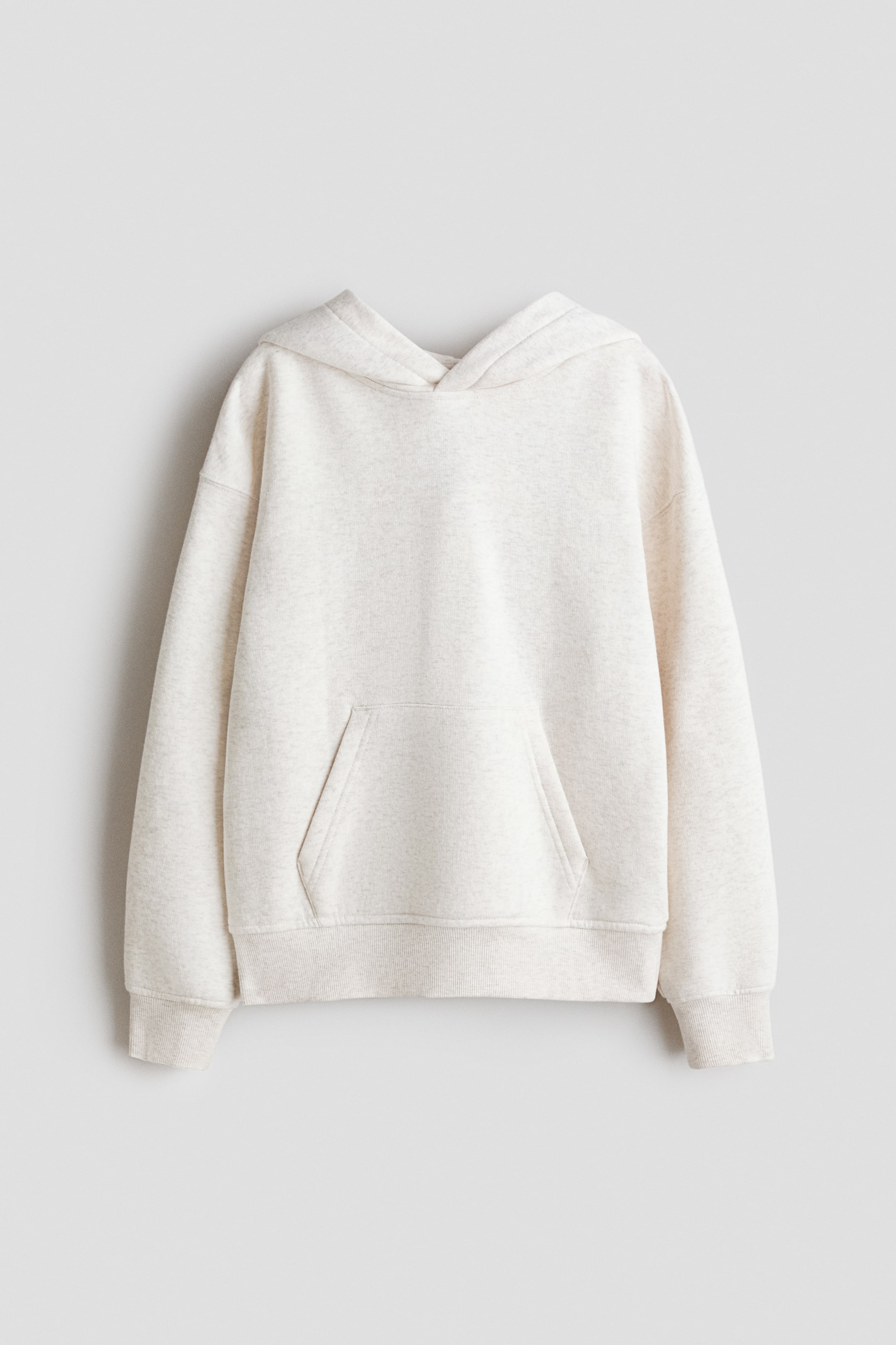 View larger image: A relaxed-fit hoodie in light melange sweatshirt fabric is shown from the FRONT, featuring a wrapover hood, dropped shoulders, long sleeves, a kangaroo pocket, and ribbed cuffs and hem.