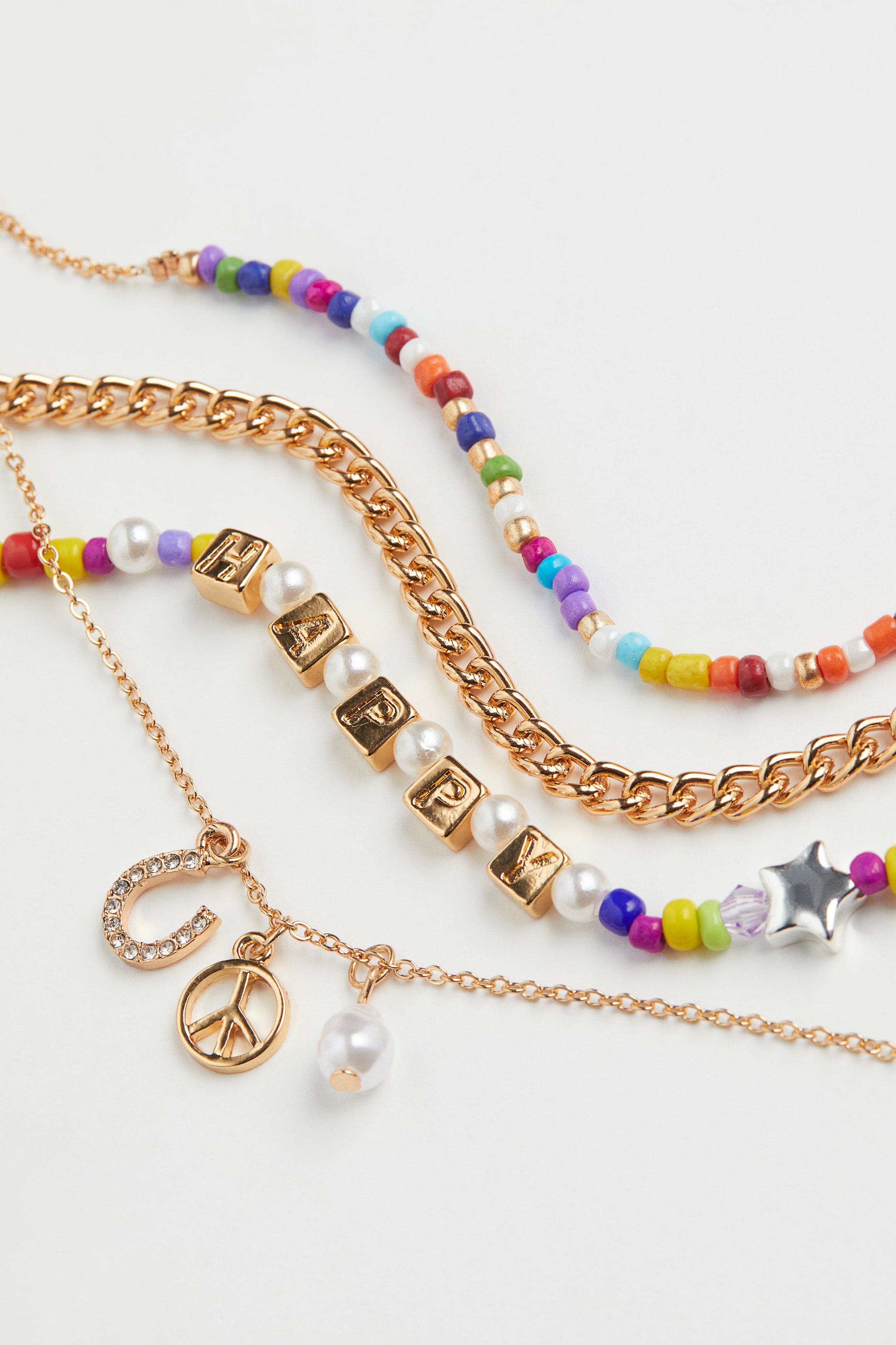 Una donna con un viso e una collana multicolori foto – Immagine gratis
