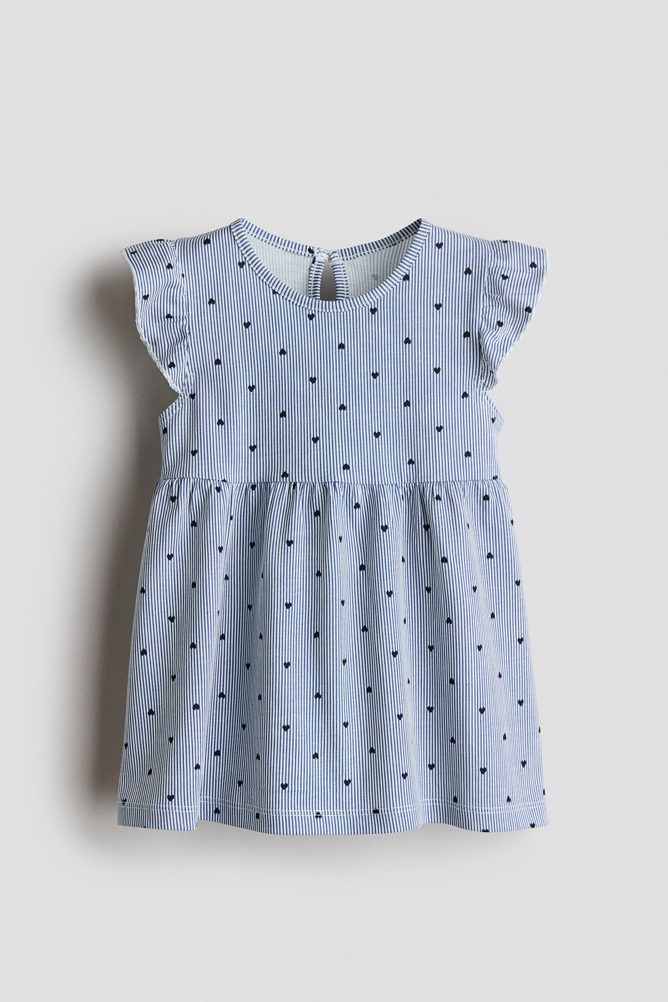 View larger image: The printed dress showcases its front view, adorned with blue and white vertical stripes complemented by small black hearts. It boasts a round neckline, flutter sleeves, gathered waist, and a flared skirt, with a keyhole opening and button visible at the back of the neckline.