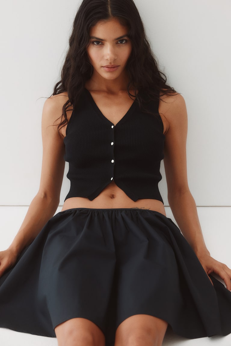 Pull sans manches à boutons