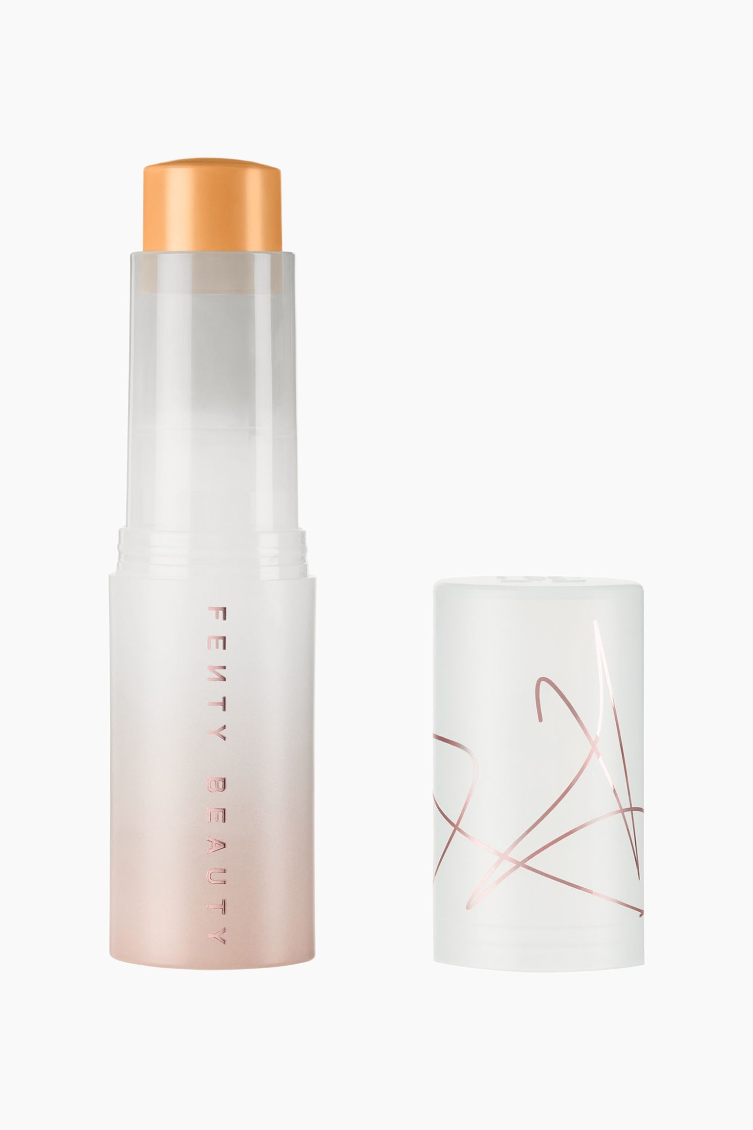 Eaze Drop Blur + Smooth Tint Stick stÃ¥r oprejst og fremviser en varm, tanfarvet cremeformel, der er trukket frem fra en matteret cylindrisk tube med en blÃ¸d rosa gradientbase og lodret brandtekst. Dens aftagelige, matterede hvide hÃ¦tte stÃ¥r ved siden af og viser abstrakt linjekunst i metallisk rosaguld.