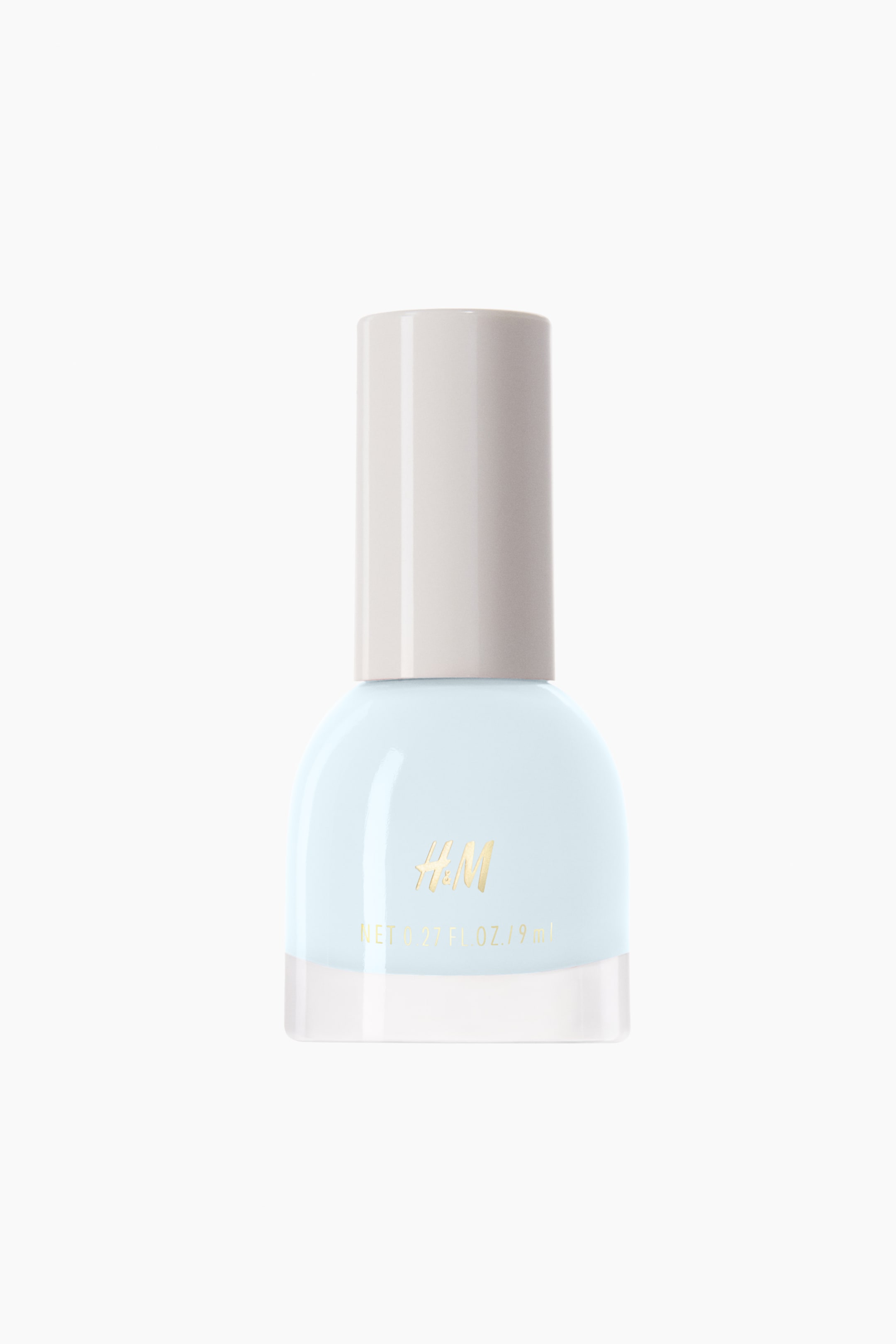 View larger image: Nail polish. The front-facing bottle showcases a light blue polish, with a clear glass base and an opaque light beige cylindrical cap. The gold "H&M" lettering and "NET 0.27 FL. OZ. / 9 ml" are prominently visible on its front.