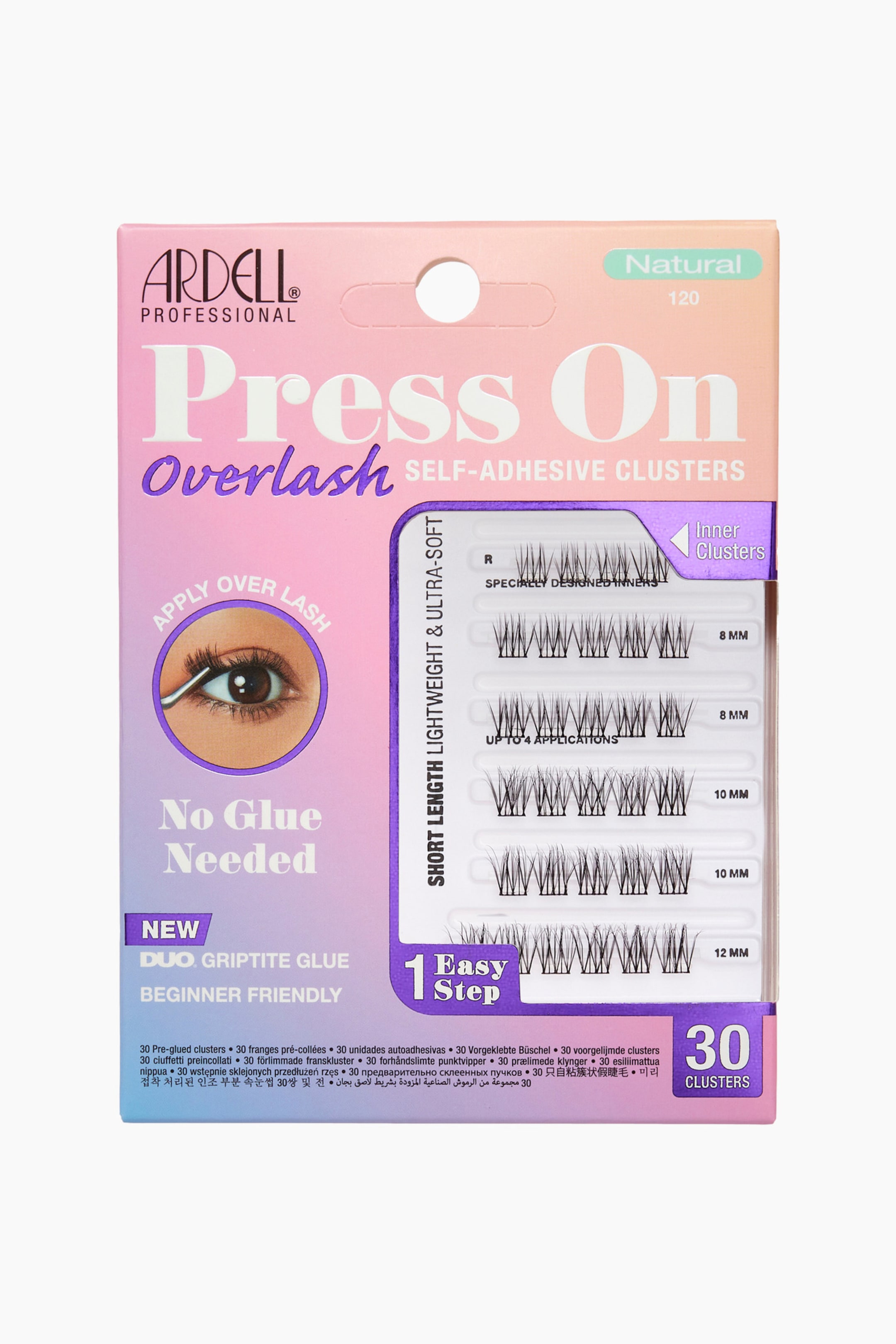 Visa större bild: Ardell Press On Overlash Natural 120-förpackningen visar trettio självhäftande franskluster som är arrangerade bakom ett transparent plastfönster på ett kort med rosa, lila och blå gradient. Fransklustren visas i horisontella rader sorterade efter längd, med två rader på 8 mm, två rader på 10 mm, en rad på 12 mm samt en översta rad med mindre kluster för den inre ögonvrån.
