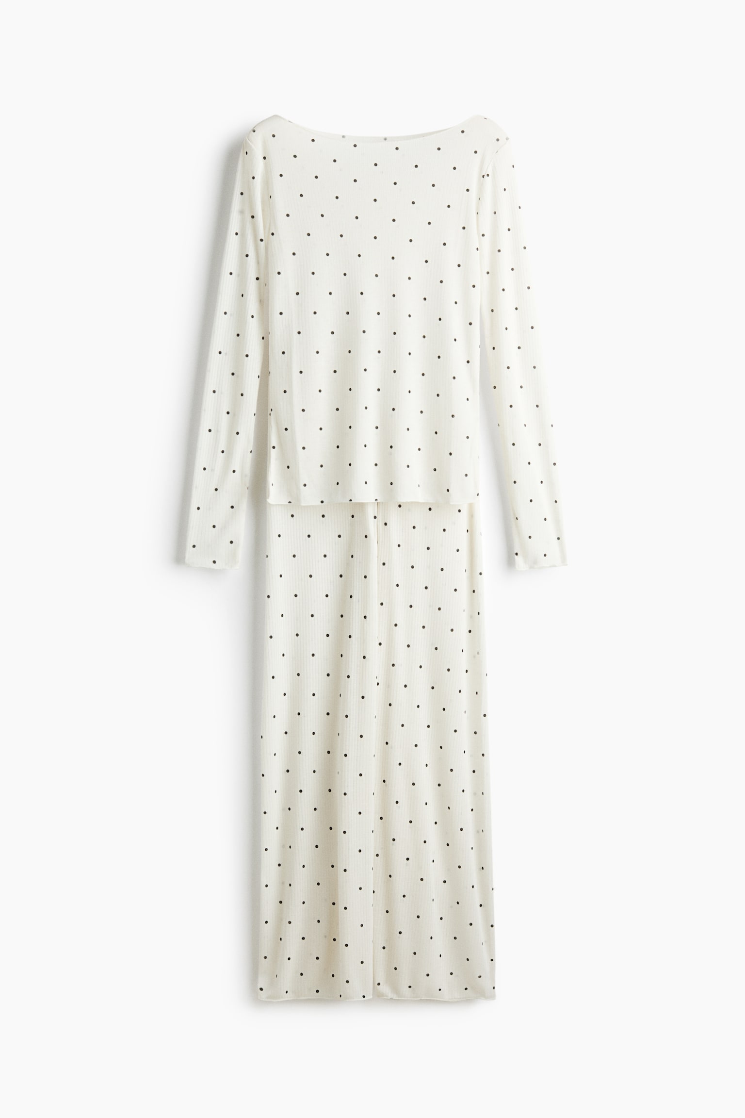 Dieses cremefarbene Pyjama-Set ist von vorne zu sehen und besteht aus einem langärmeligen Oberteil mit U-Boot-Ausschnitt sowie einer passenden weit geschnittenen Hose aus geripptem Jersey-Stoff mit schwarzem Punktemuster. Beide Teile zeigen Overlock-Kanten und eine leicht transparente Textur. - 1