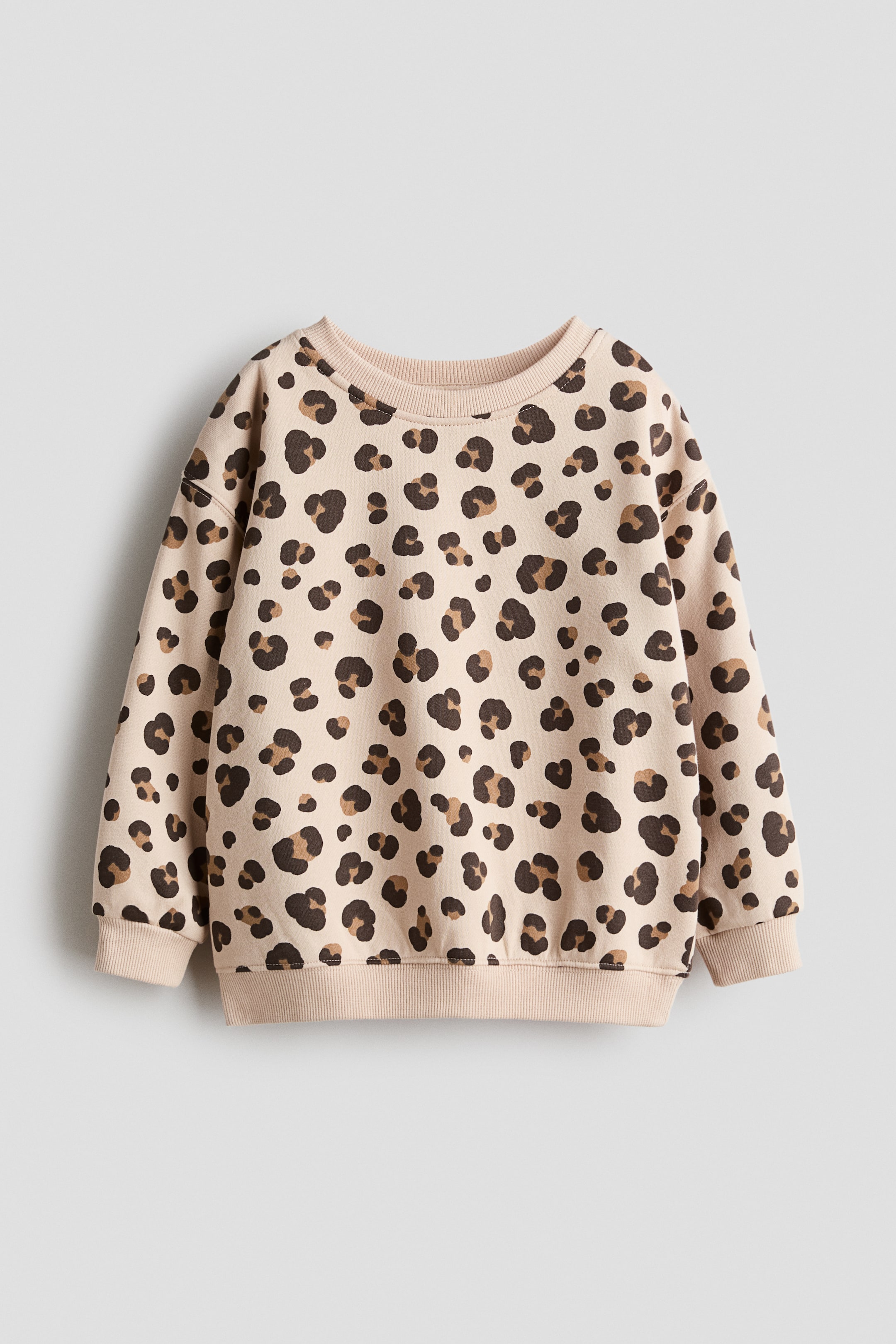 View larger image: A sweatshirt features a leopard-print design across the front, with a round, rib-trimmed neckline, gently dropped shoulders, and ribbed cuffs and hem.