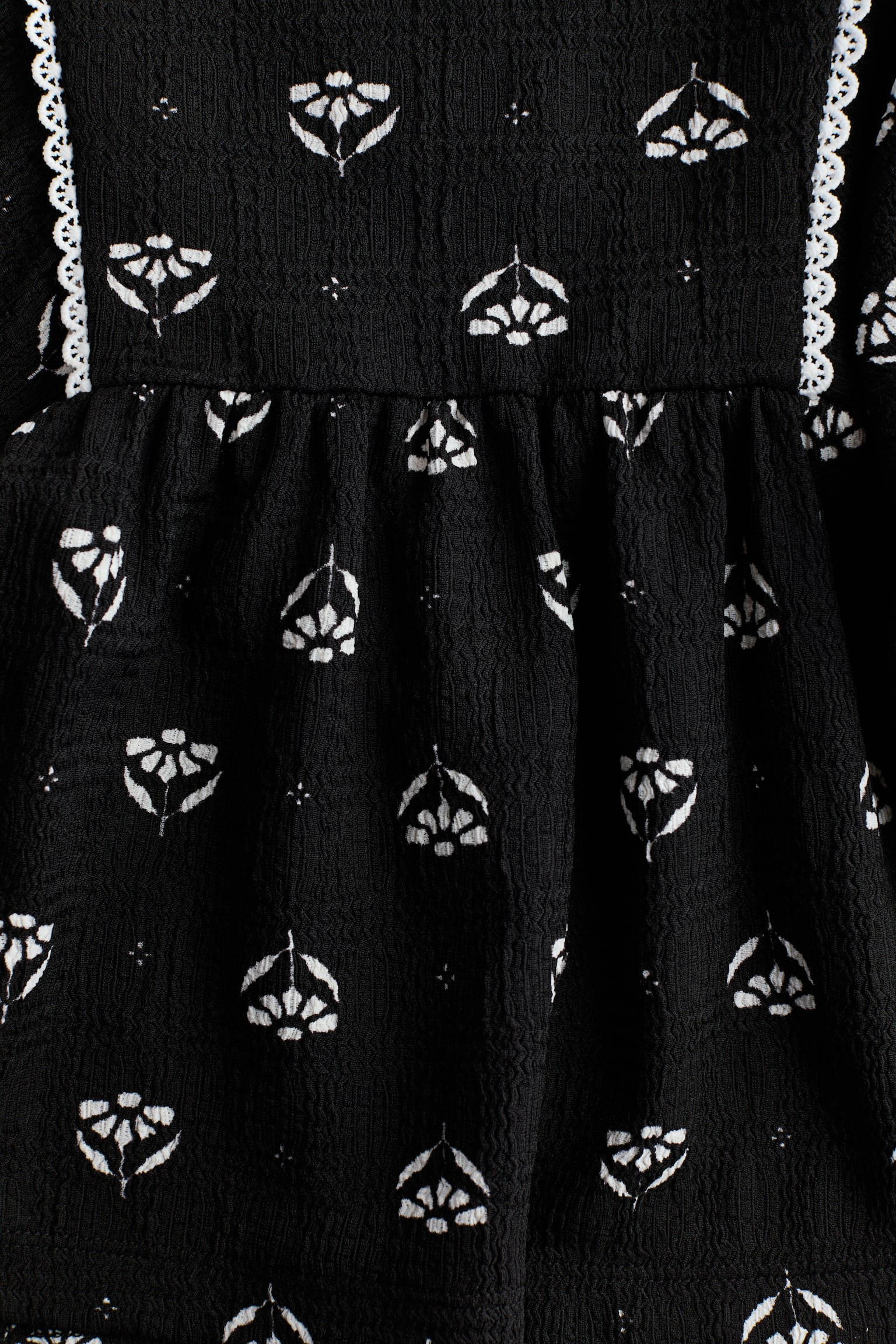 Блуза із фактурного трикотажу - Чорний/квітчастий/Білий - 4