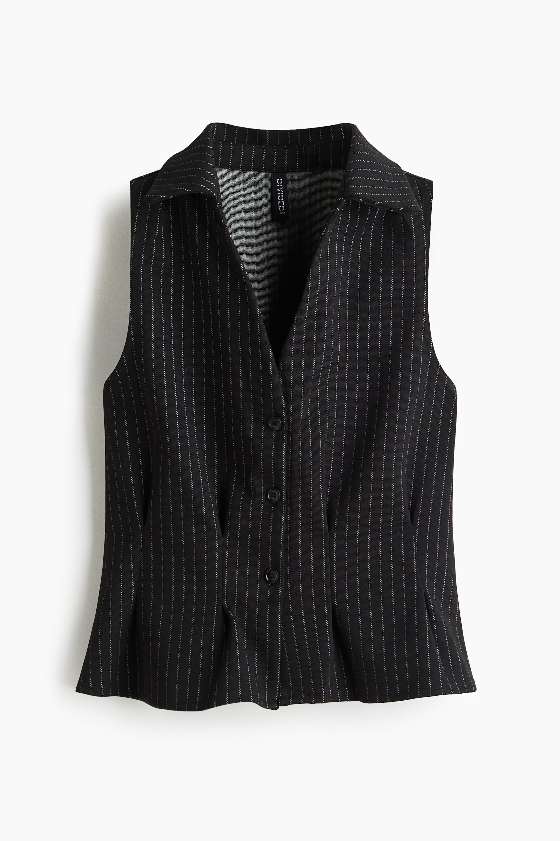 View larger image: A black pinstriped vest is presented front-facing, featuring a pointed collar, a V-neckline, and a button-front closure with three visible black buttons. Vertical white pinstripes are running down the sleeveless garment, which is detailed with shaping darts on the lower front.