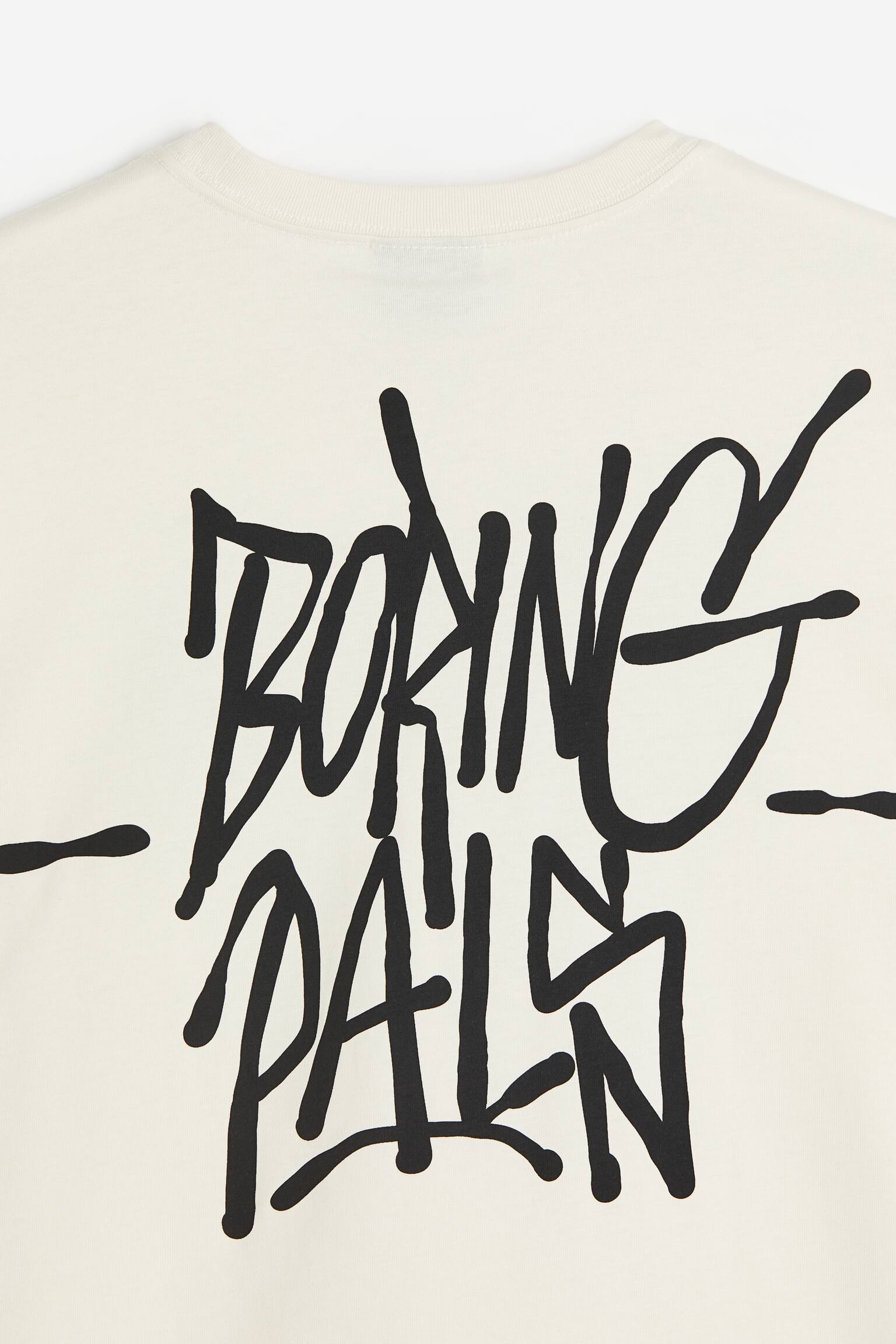 Áo thun in hình Loose Fit - Màu kem/Boring Pals/Màu xanh dương nhạt/Grand Lake/Màu xanh lá xám/Angle Ridge/Màu vàng/Enjoy the Present/Màu trắng/Pasta/Xanh dương nhạt/Le Club Bleu/Màu nâu/Adapt/Màu xanh dương/Still Water/Màu trắng/Greek Sardines/Màu đen/Lost Time/Màu trắng/Cologne/Màu đen/Carbonara/Màu trắng/Playa de Alcudia - 3