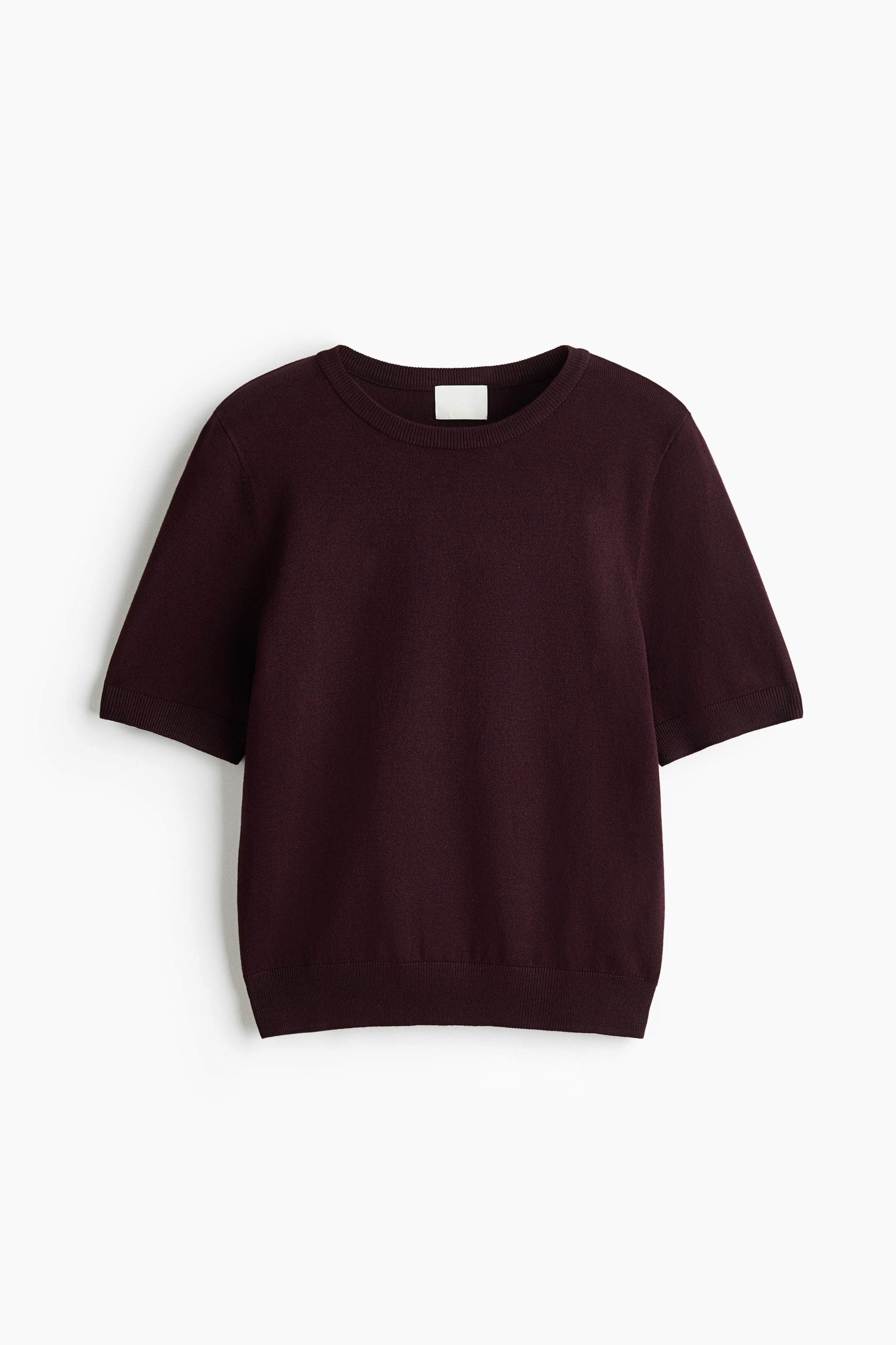 View larger image: A dark burgundy, fine-knit short-sleeve top is shown from the front, featuring a ribbed crew neckline, ribbed cuffs, and a ribbed hem.