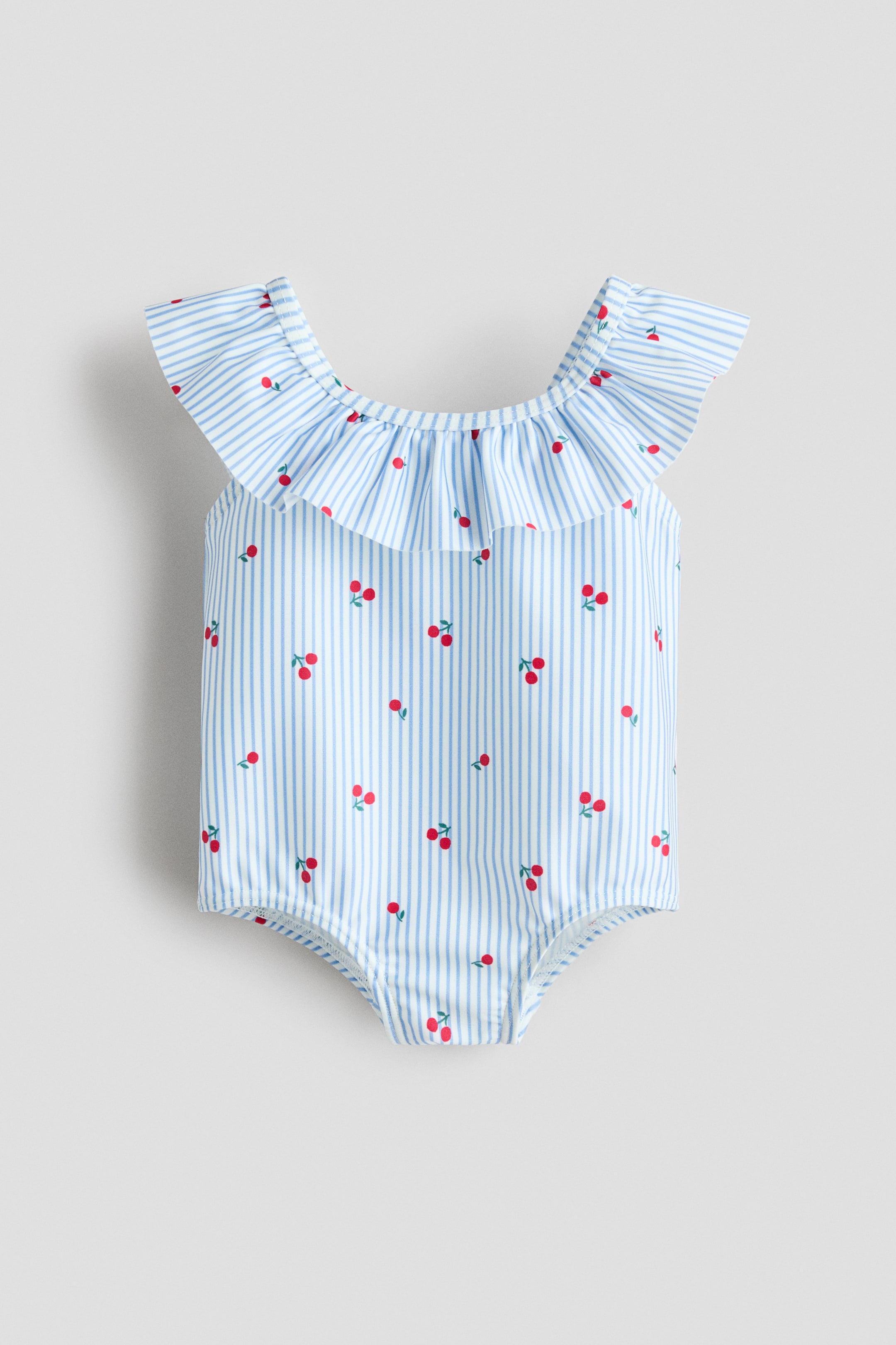 View larger image: It is designed with a ruffled neckline that extends to form short sleeves.