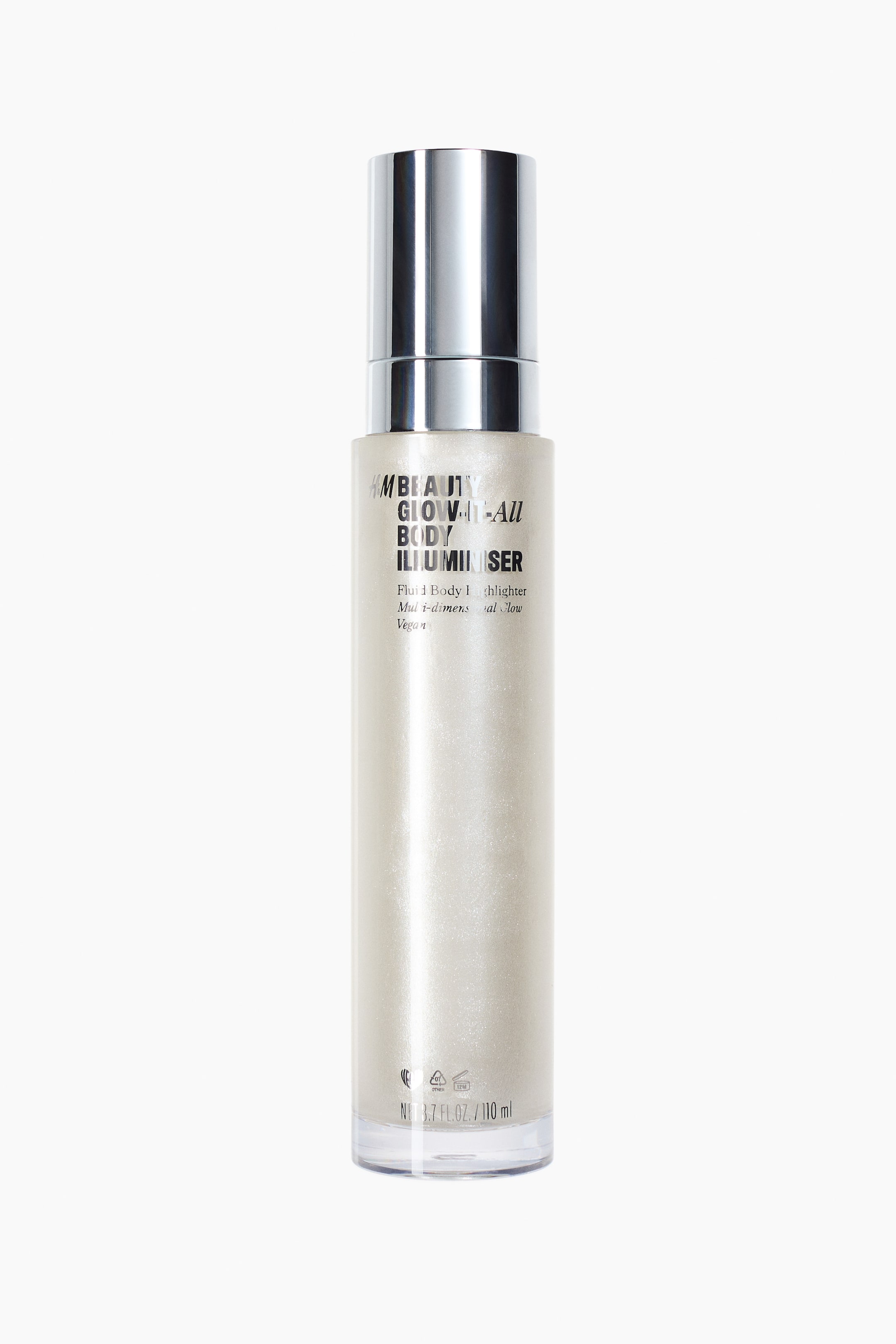 View larger image: The Glow-It-All Body Illuminizer is a front-facing, cylindrical bottle. It features a shiny silver pump top and a clear body containing a shimmery, pearlescent beige liquid. The text "H&M BEAUTY GLOW-IT-ALL BODY ILLUMINIZER" is printed on the front of the bottle.
