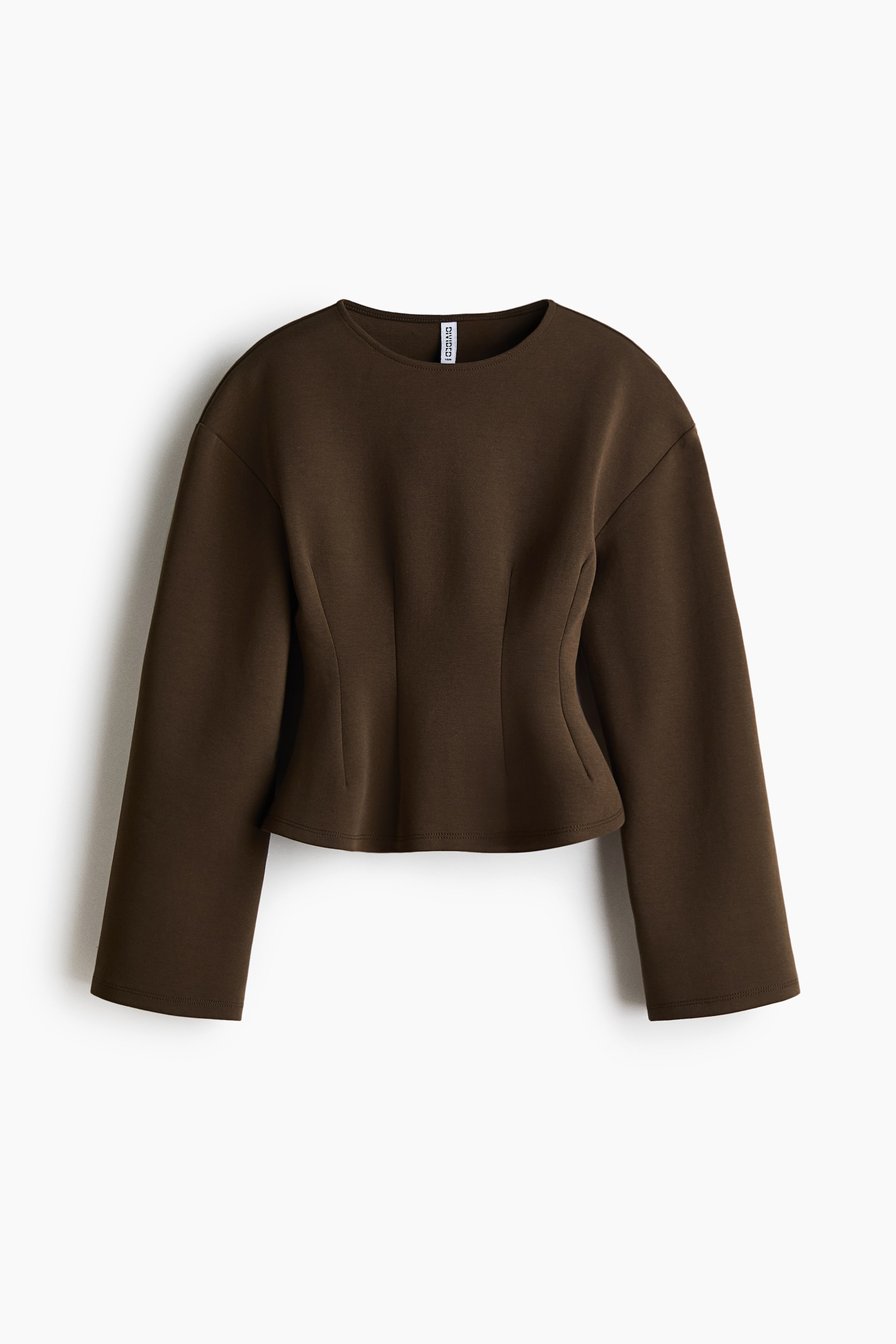 View larger image: A dark brown cropped top is showing from the FRONT, featuring a round neck, long wide sleeves, and a fitted waist that is flaring into a subtle peplum hem. The top is presenting a smooth, structured fabric.