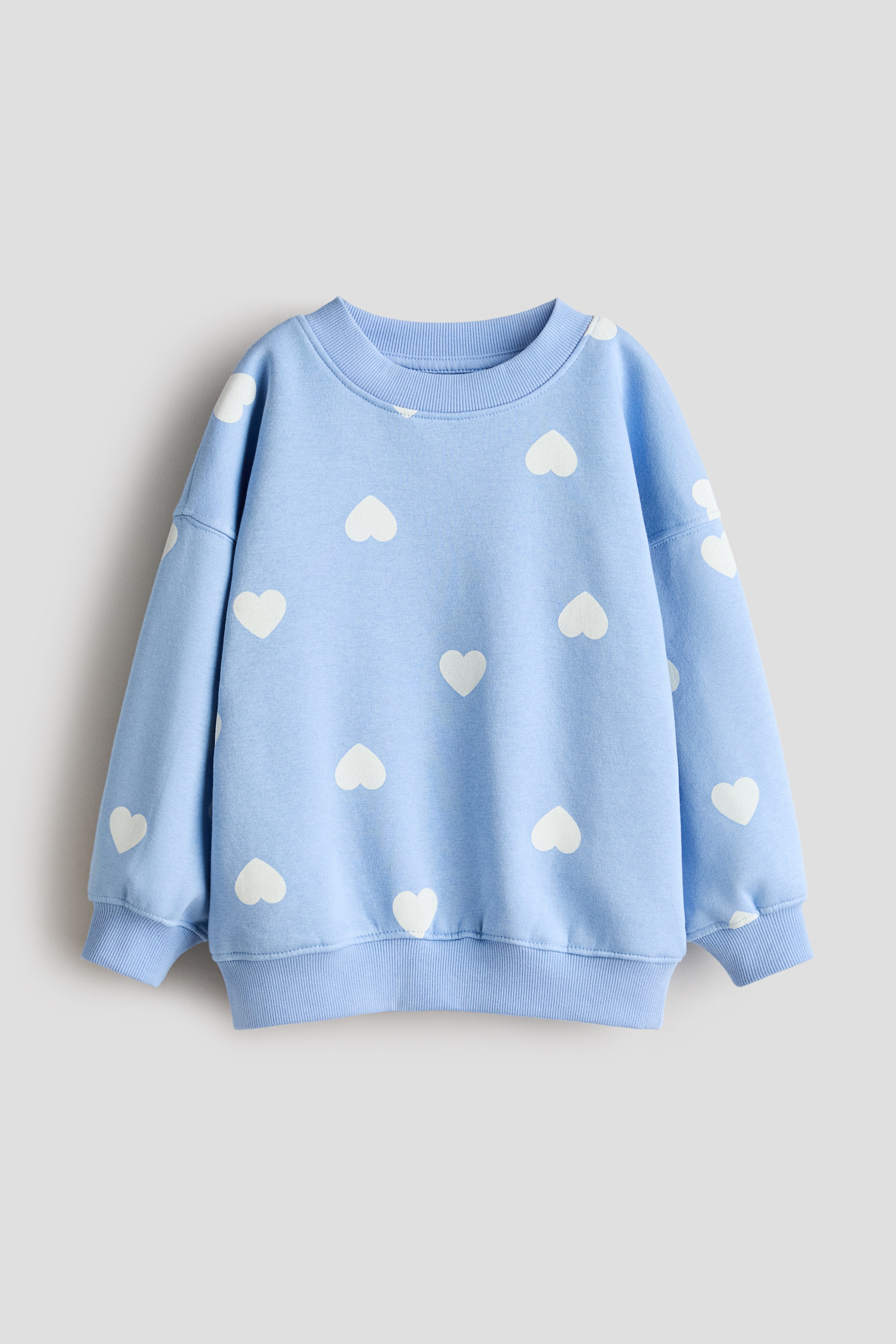 View larger image: Oversized Brushed-Inside Sweatshirt - Blue/hearts - Kids | H&M US 1