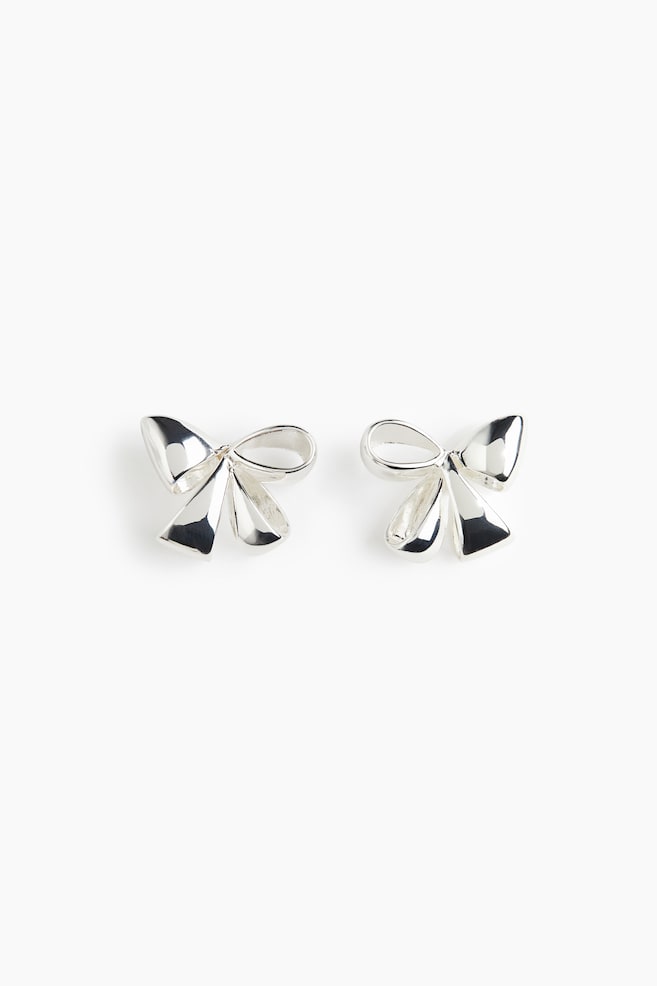 Bow-shaped stud earrings - Silver-coloured/Gold-coloured - 1