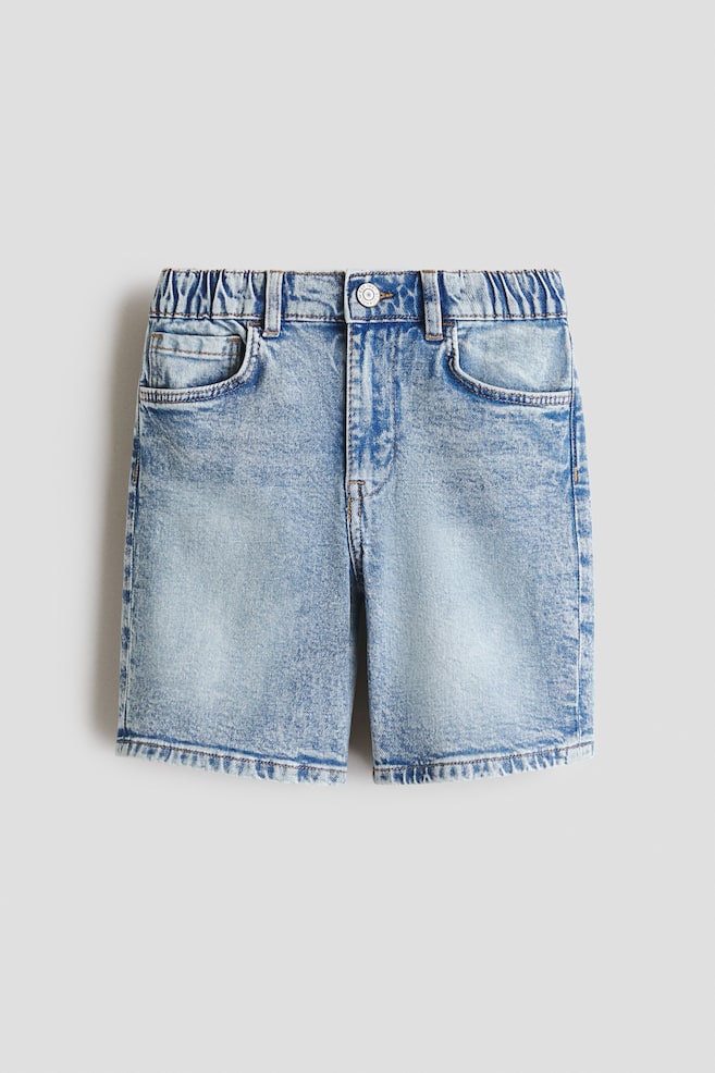 Light blue denim shorts are shown from the front with a stone-washed finish. They feature a partially elasticated waistband with belt loops, a button closure, and front pockets including a coin pocket. The shorts are finished with a distressed hem. - 1