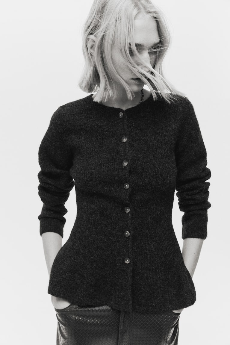 Gilet péplum en maille côtelée