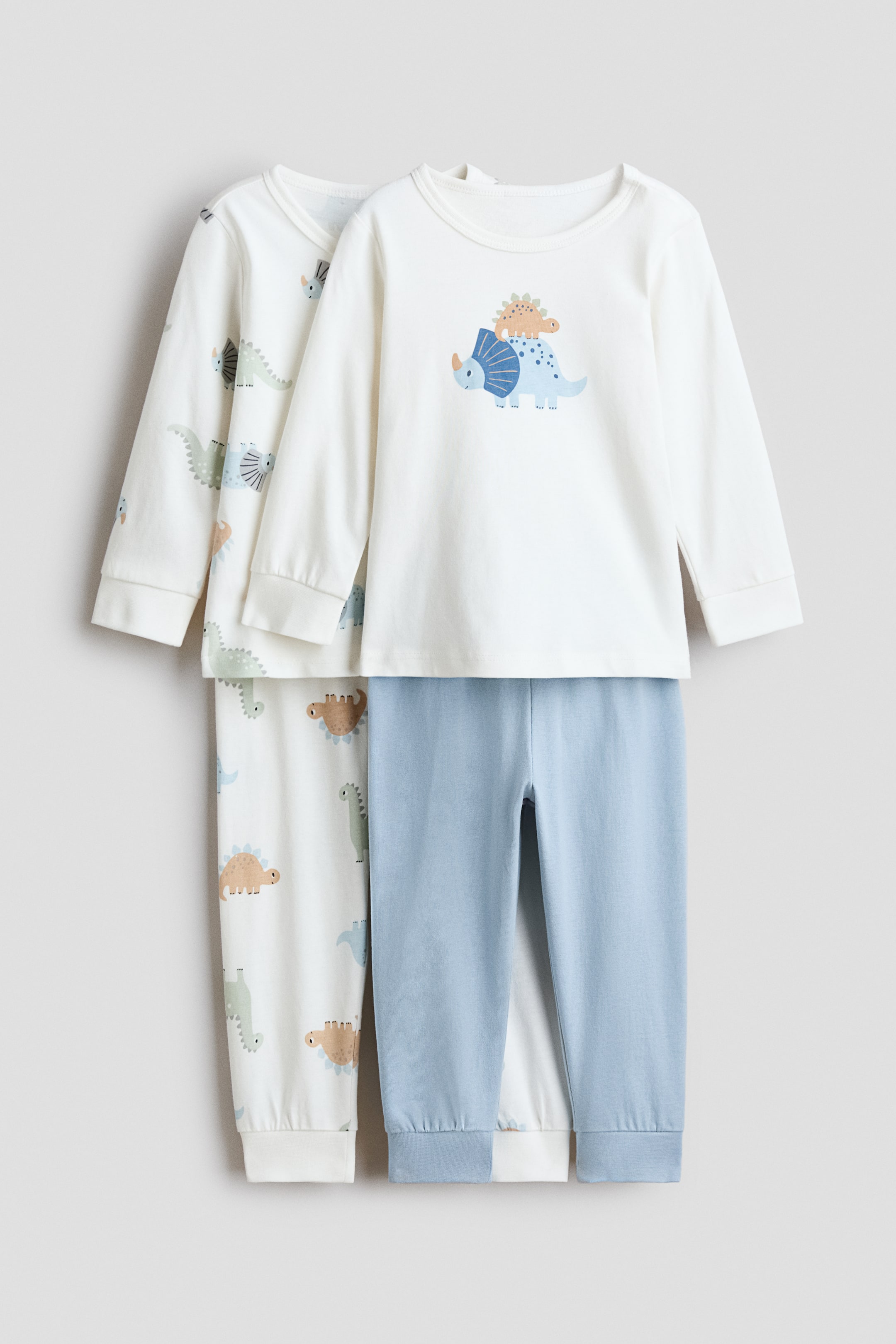 Ver imagem maior: Pack de 2 pijamas em algodão com estampado - Branco/Dinossauros - CRIANÇA | H&M PT 1