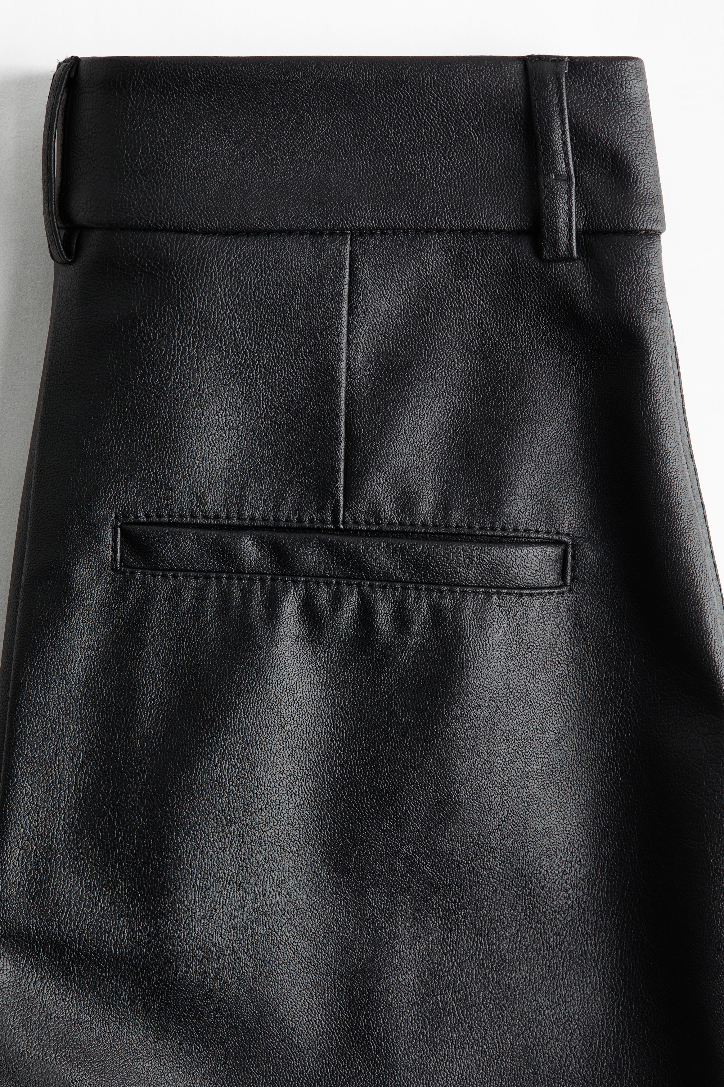 Flared coated trousers