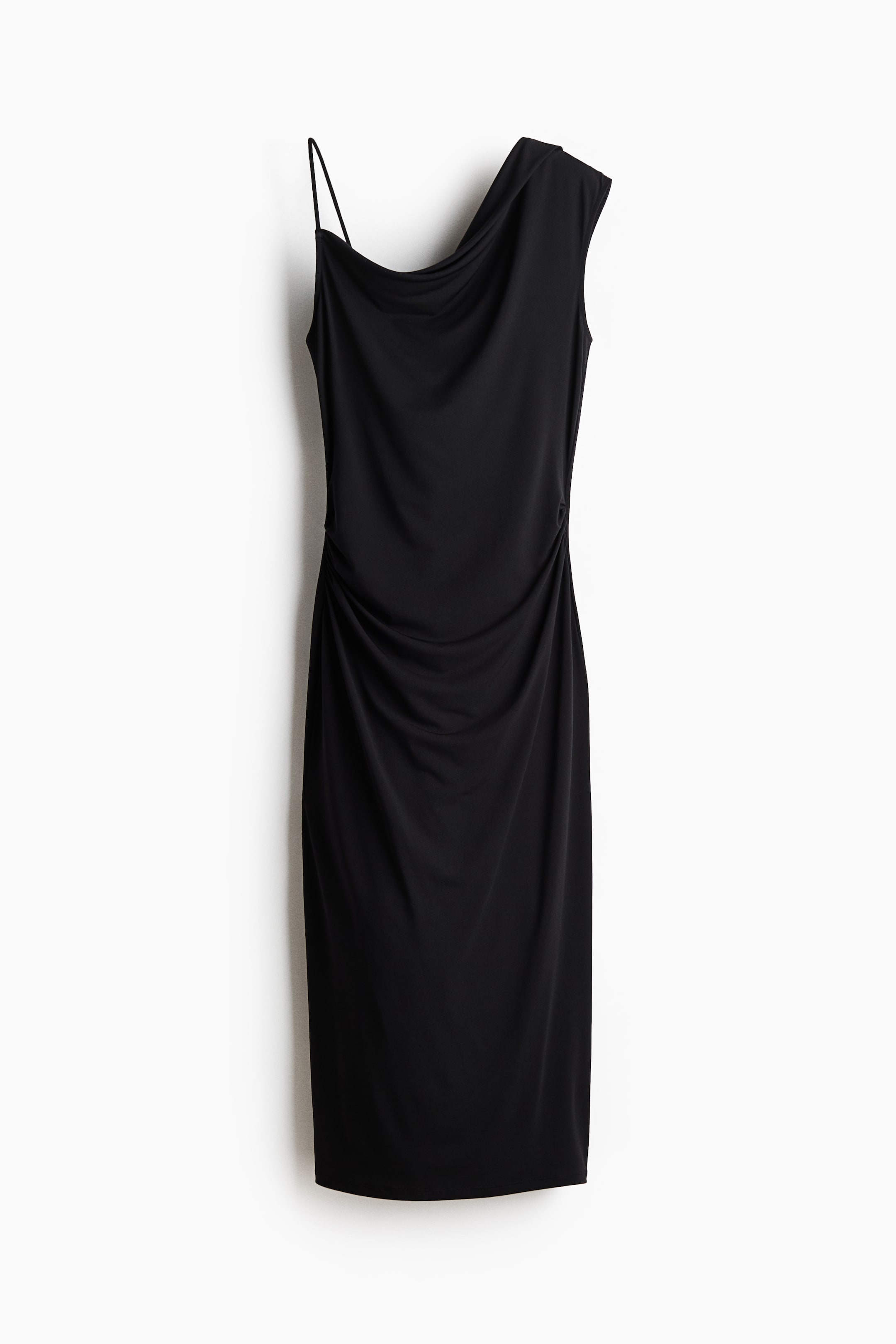 View larger image: A black one-shoulder midi dress is showcased from the front. It features a thin spaghetti strap on the left and a draped, wider strap on the right, forming a cowl neckline. Ruched detailing is visible along the right side of the fitted silhouette.