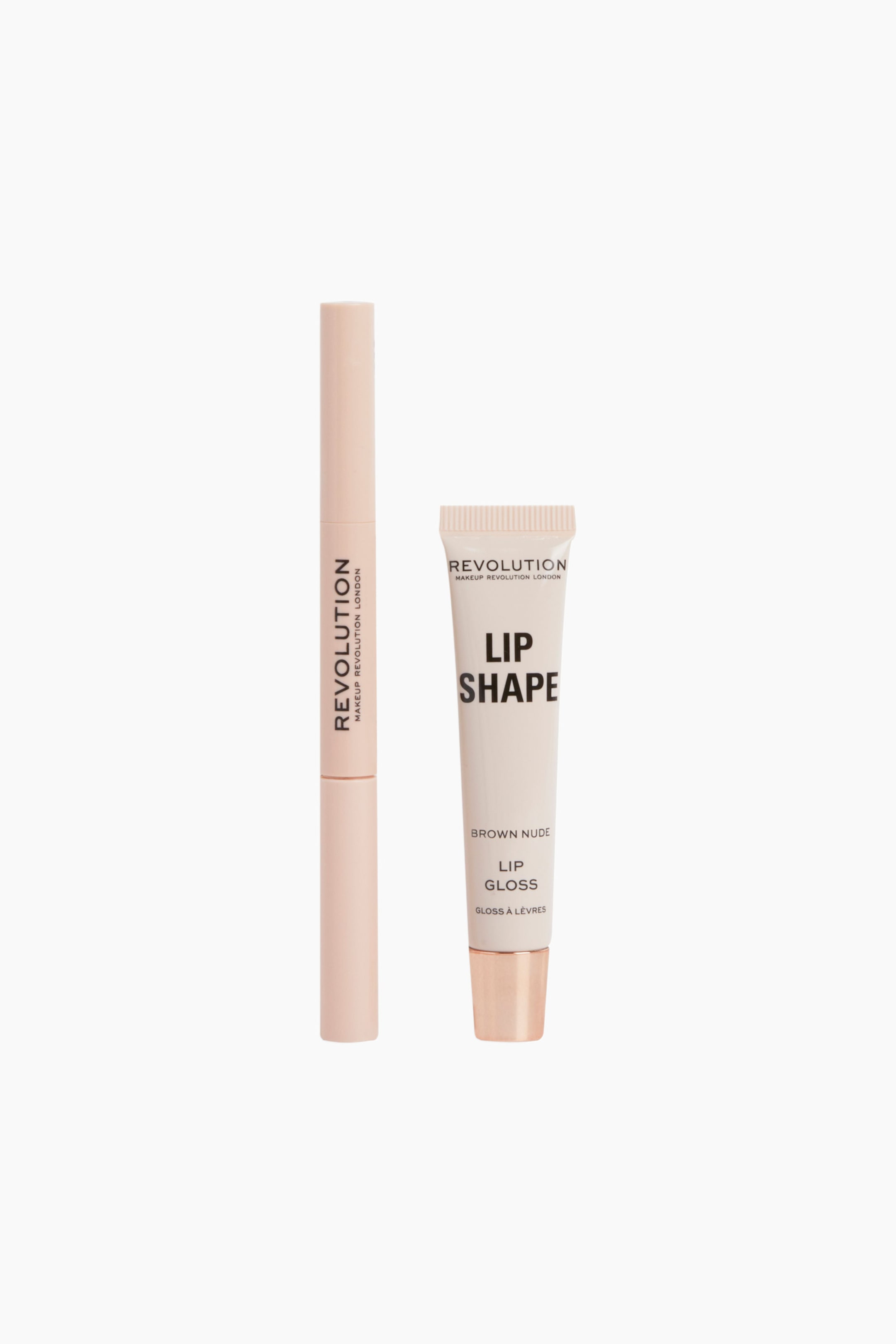 Visa större bild: Lip Shape Lip Kit innehåller en smal, ljusrosa läppenna och en matchande klämbar tub med läppglans, båda placerade upprätt i framåtriktat läge. Läppennan har vertikal svart märkning, medan läppglanstuben visar tydlig text och avslutas med en metallisk roséguldfärgad kork.