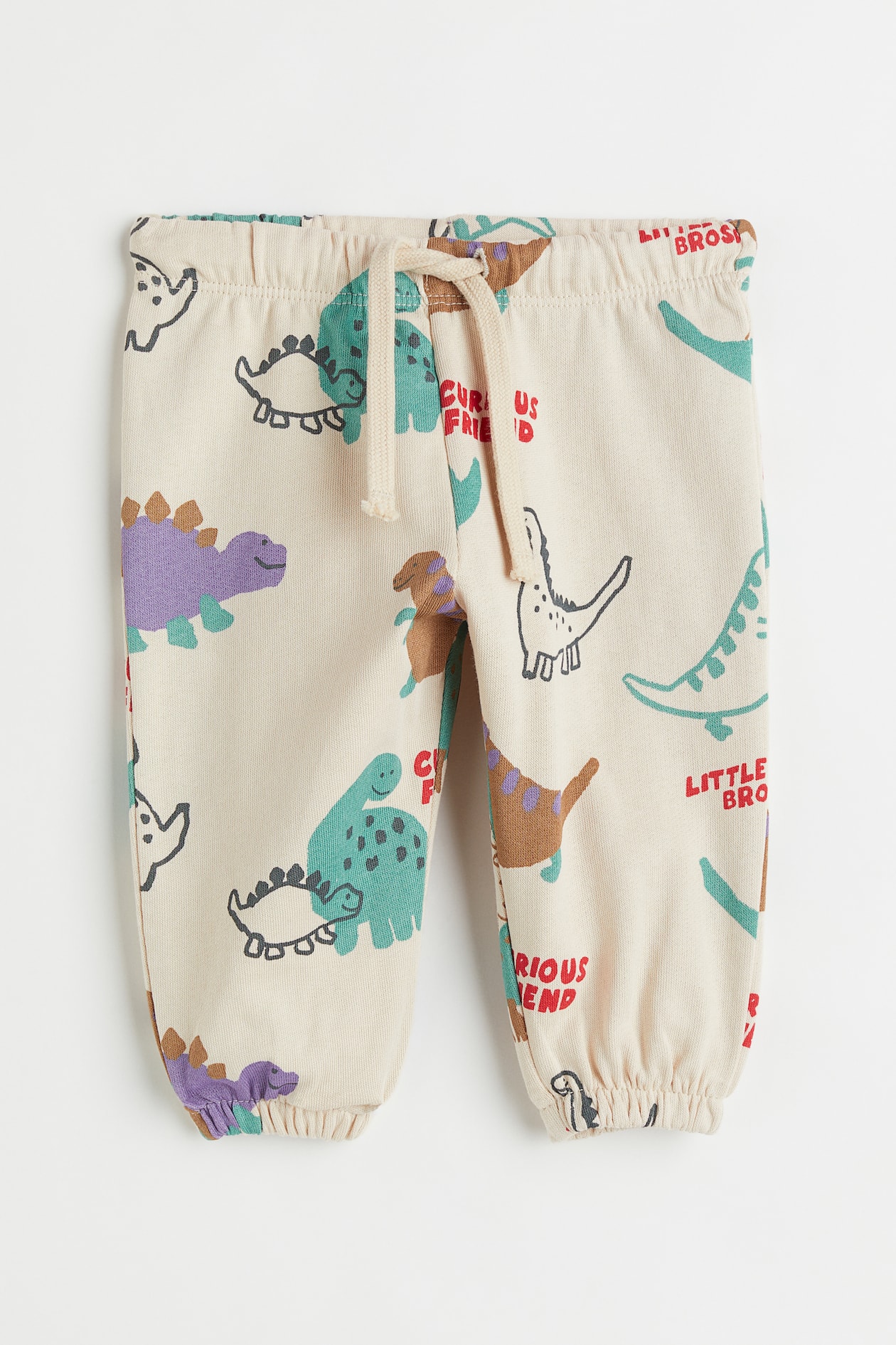 Joggers - Regular waist - Long - Light beige/dinosaurs - Kids | H&M US