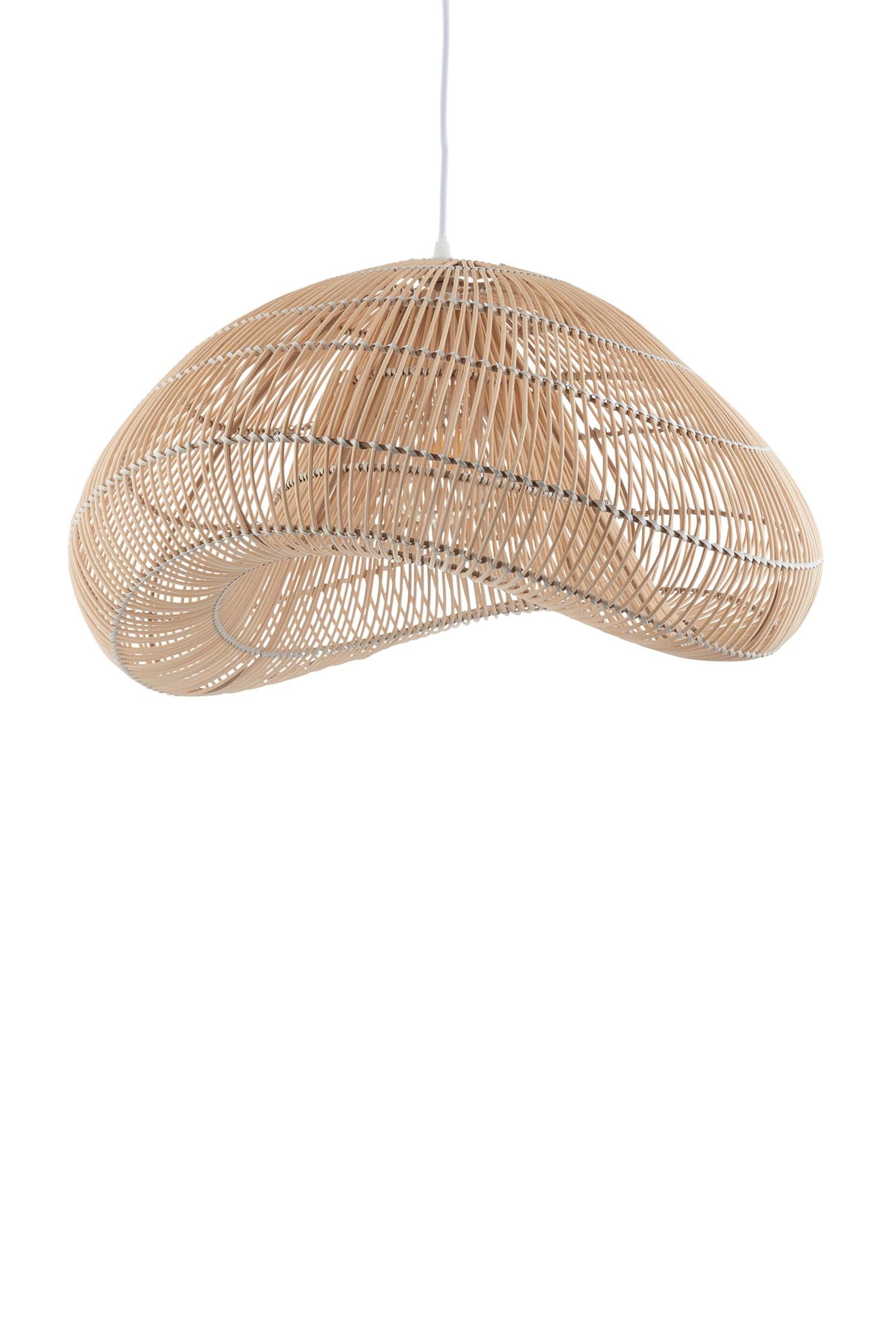 View larger image: A natural rattan pendant light shade is suspended from a white electrical cord, showcasing an irregular, organic form. Thin, light brown rattan strands are woven into an open, undulating pattern.