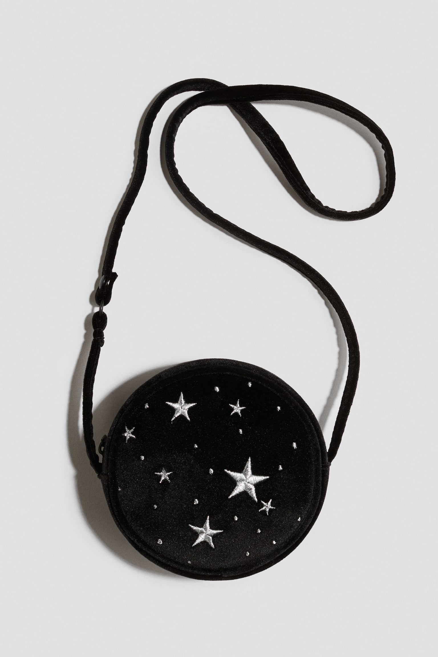 Round crossbody bag - Black/Stars