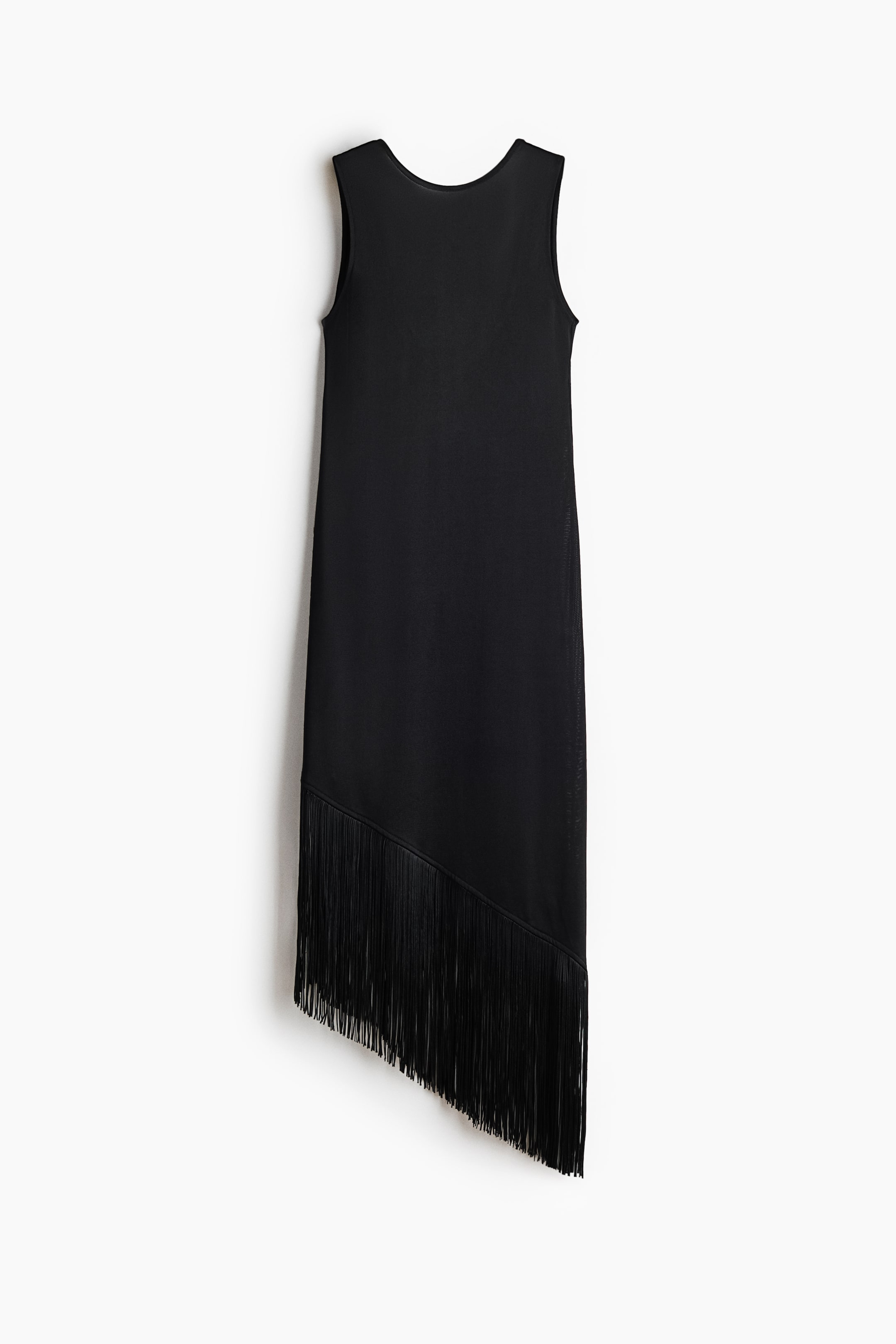 View larger image: A black sleeveless dress featuring a simple scoop neckline and an asymmetrical hemline with long, black fringe detailing along the diagonal edge.