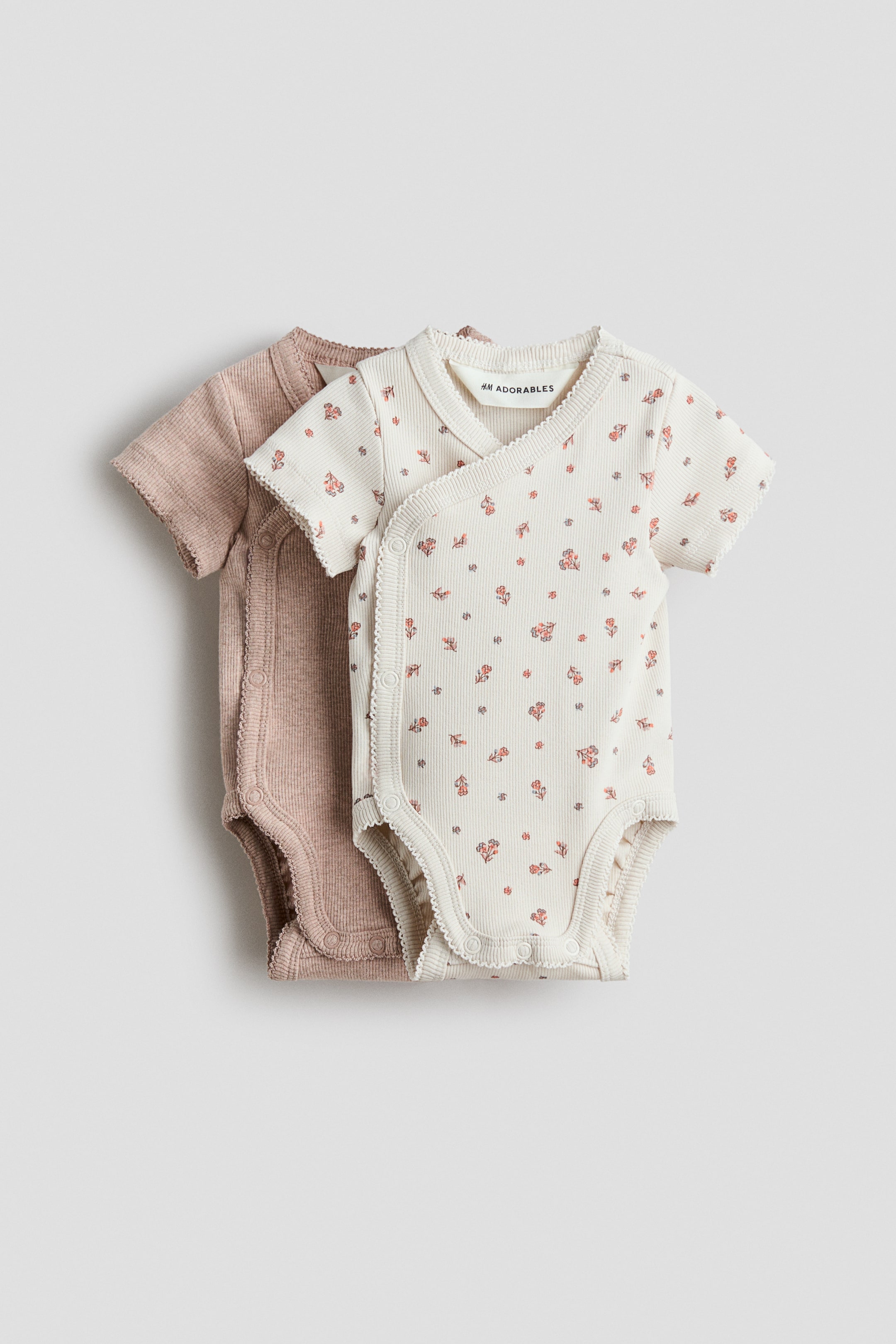 Ver imagem maior: Pack de 2 bodies traçados canelados - Bege/Floral - CRIANÇA | H&M PT 1