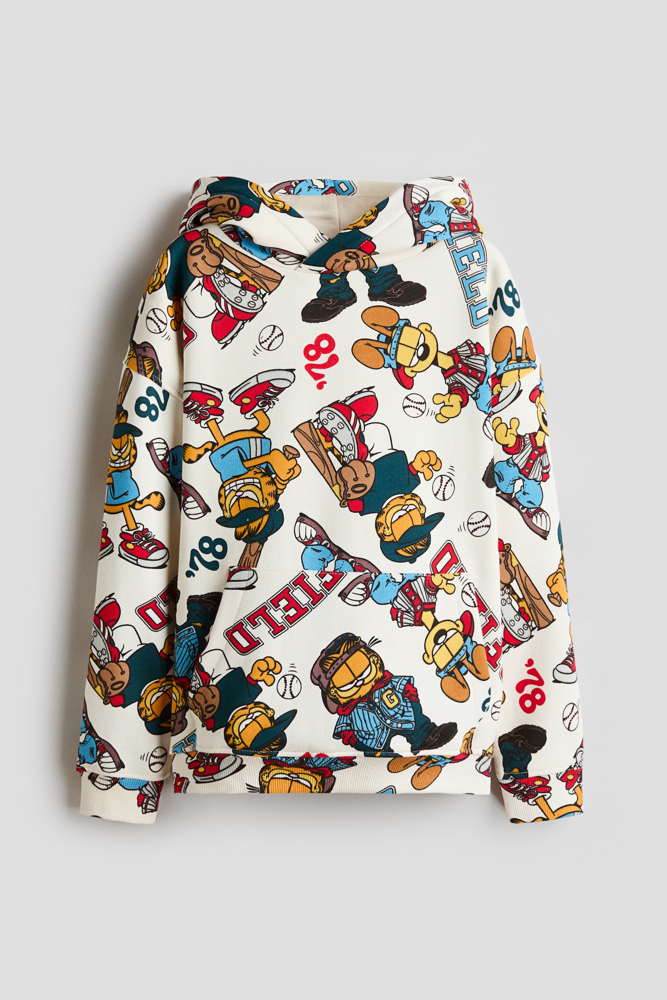 View larger image: A loose-fit hoodie is shown from the front, featuring cream-colored sweatshirt fabric with an all-over cartoon baseball print, a lined hood with a wrap-front design, dropped shoulders, a kangaroo pocket, and ribbed cuffs and hem.