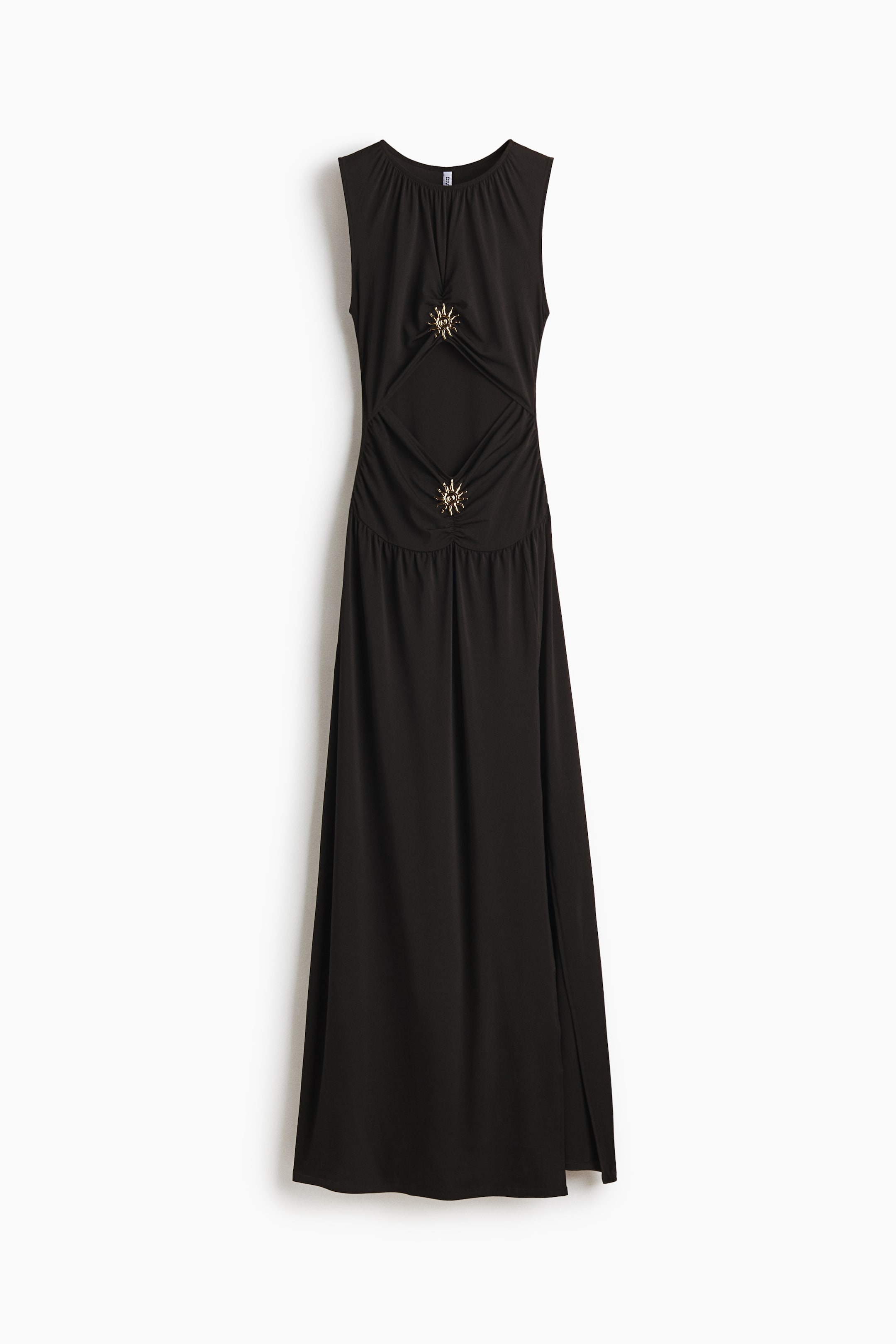 View larger image: Presenting a black sleeveless maxi dress in stretch jersey, designed to captivate from the front. It features a round neckline and a fitted, gathered bodice with an eye-catching diamond-shaped cut-out at the waist. The bodice is elegantly adorned with two gold-toned sunburst metal decorations placed above and below the cut-out. Completing this stylish ensemble is a flared skirt that boasts a high slit on the left front side, adding a touch of allure to the dress.