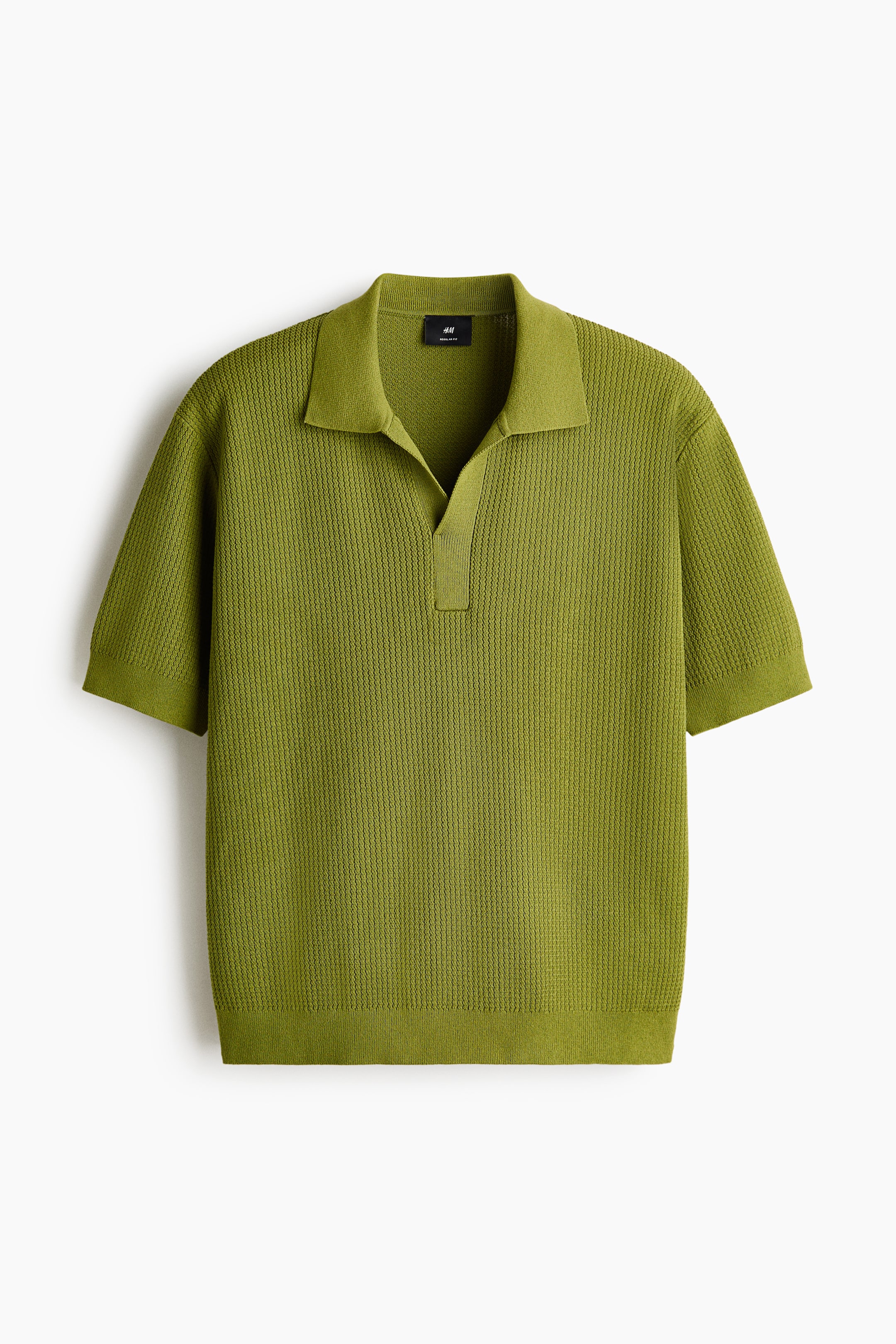 View larger image: The front view of a green fine-knit polo shirt showcases a straight and subtly relaxed silhouette. It includes a collar, an open placket, short sleeves, and ribbed detailing at the cuffs and hem.