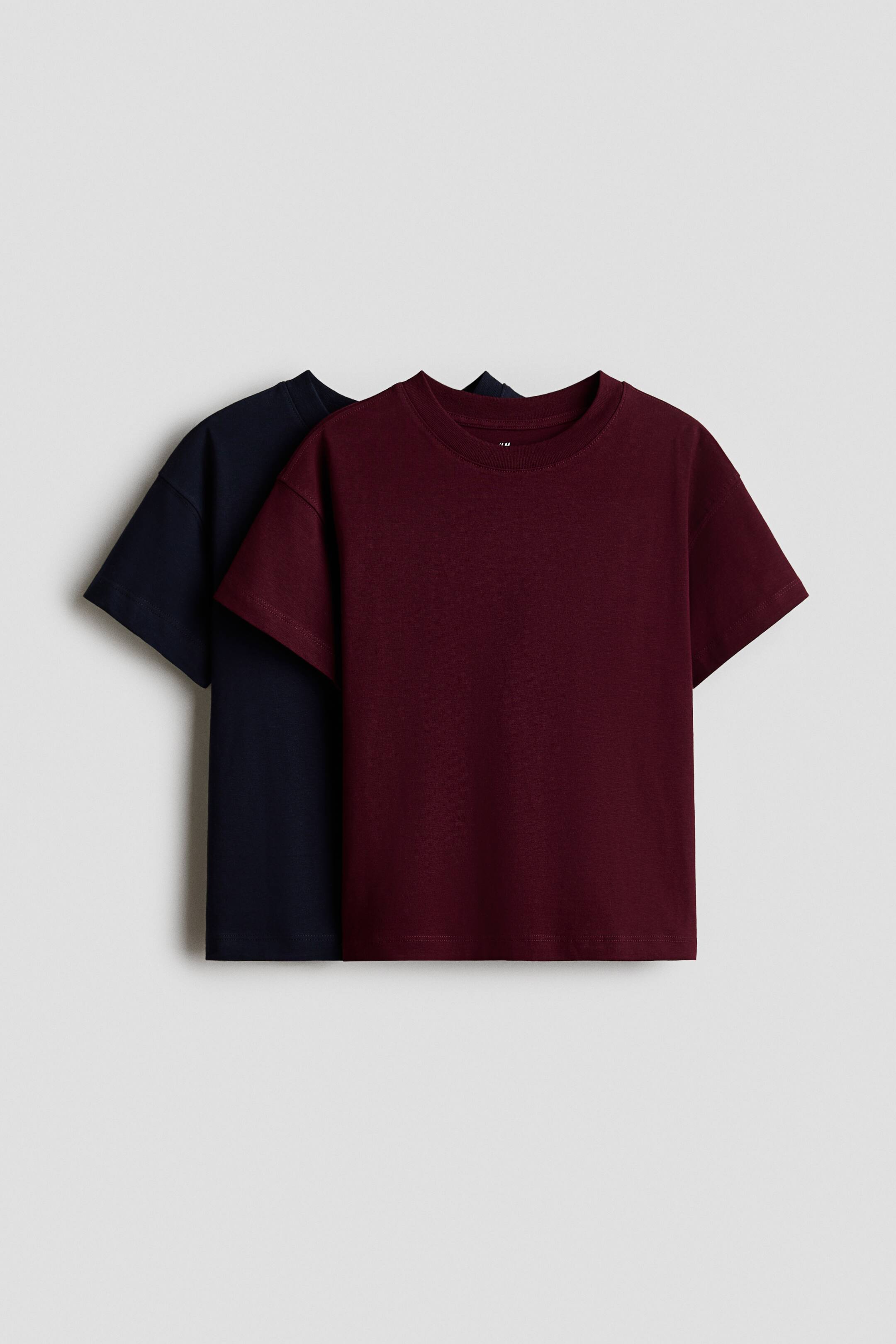 View larger image: A dark red crew-neck T-shirt is layered over a dark blue crew-neck T-shirt. Both short-sleeved shirts are facing forward.
