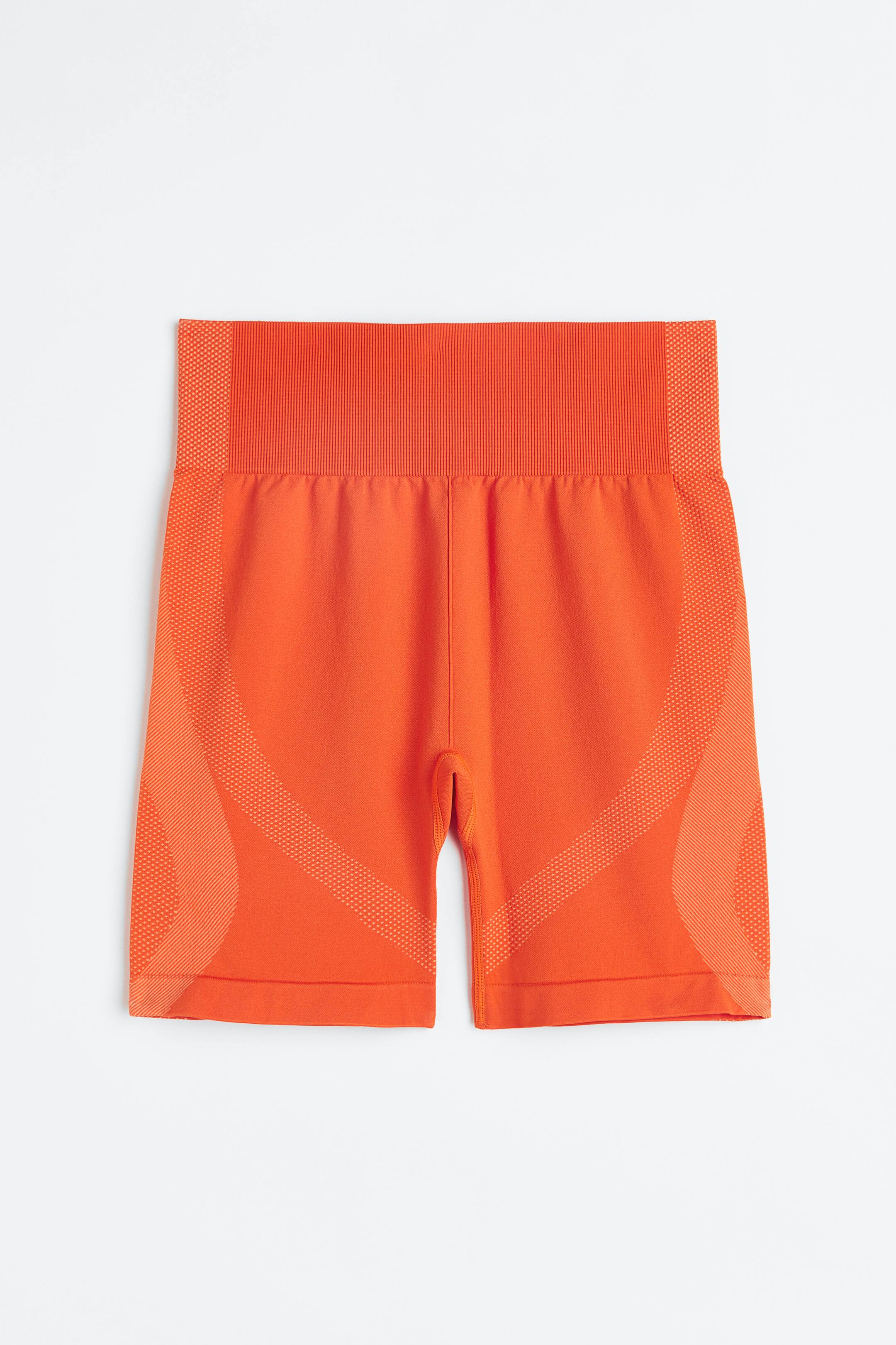 Xem ảnh lớn hơn: Quần short đạp xe thể thao không may vải DryMove™ - Màu cam - Ladies | H&M VN 1