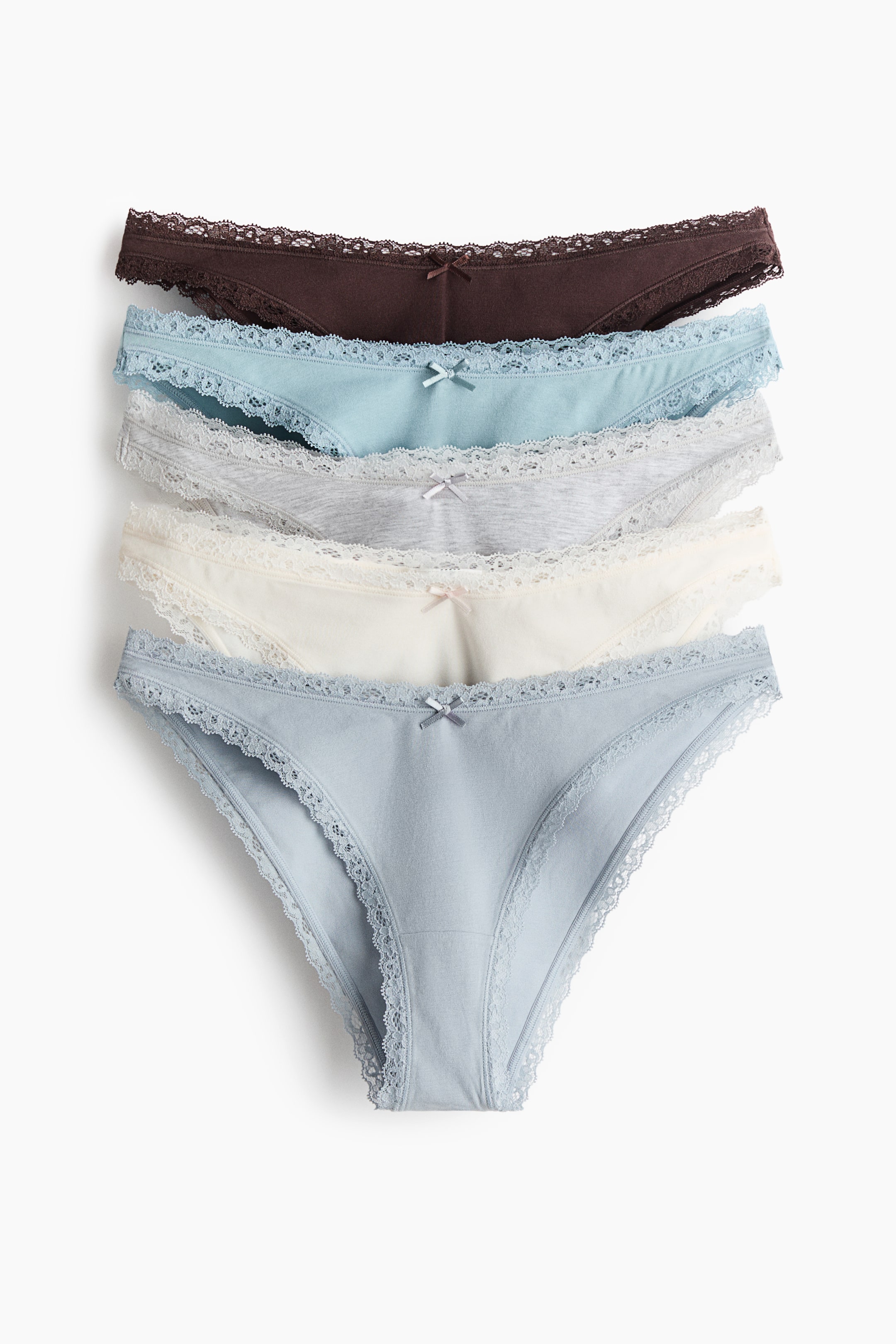 View larger image: Five pairs of cotton jersey briefs are stacked, showing the front view; each features delicate lace trims along the low, V-shaped waist and leg openings. The briefs appear in a range of solid colours, including brown, light blue, light grey, off-white and pale blue.