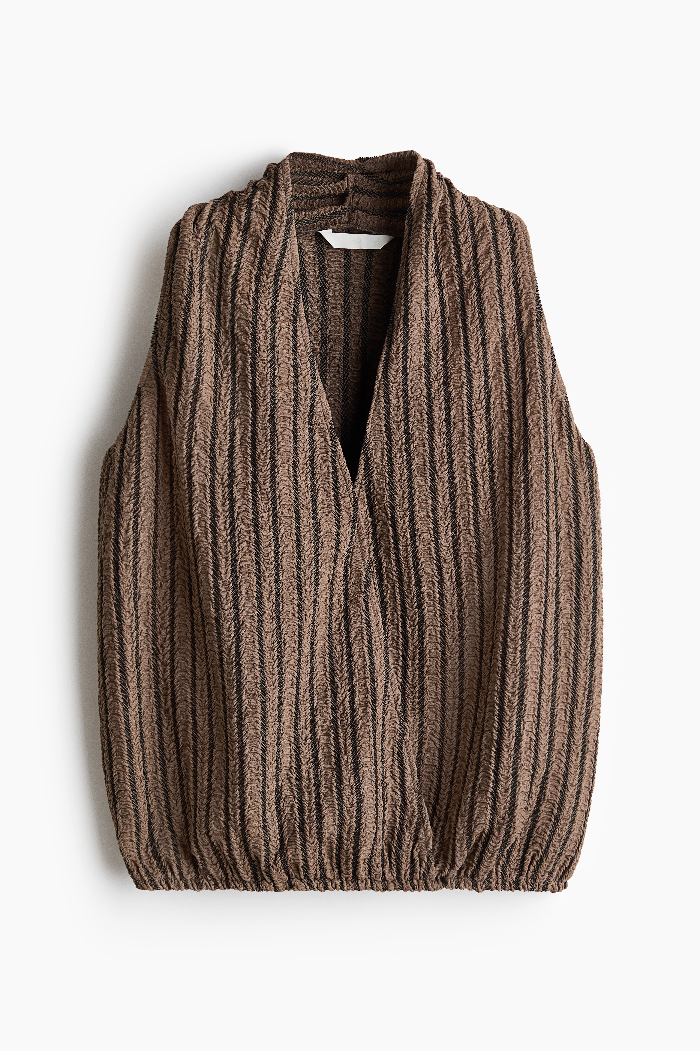 Top goffrato con scollo a V