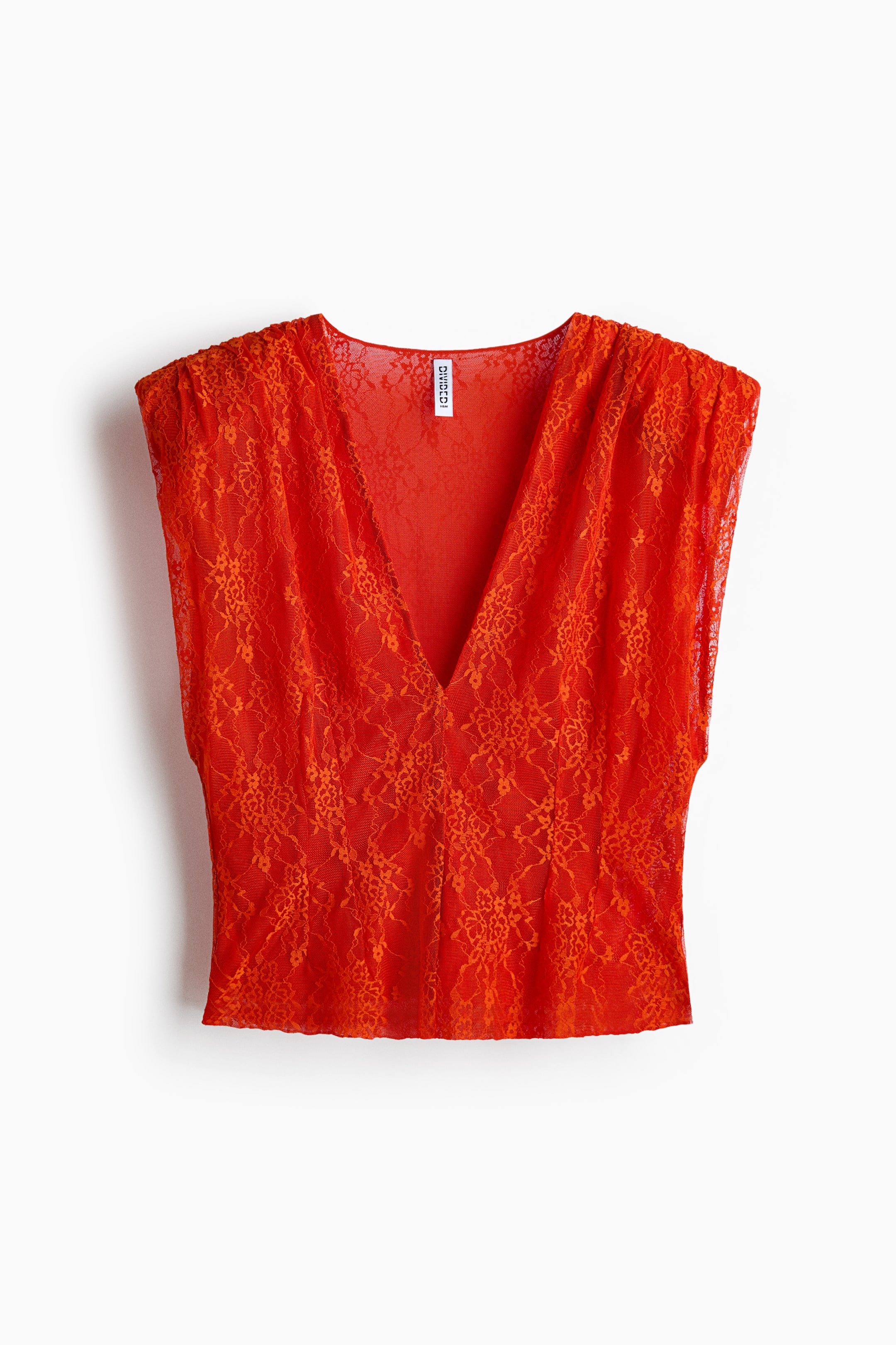View larger image: The red lace top showcases a deep V-neckline, short gathered cap sleeves, and a floral lace pattern throughout its sheer fabric.
