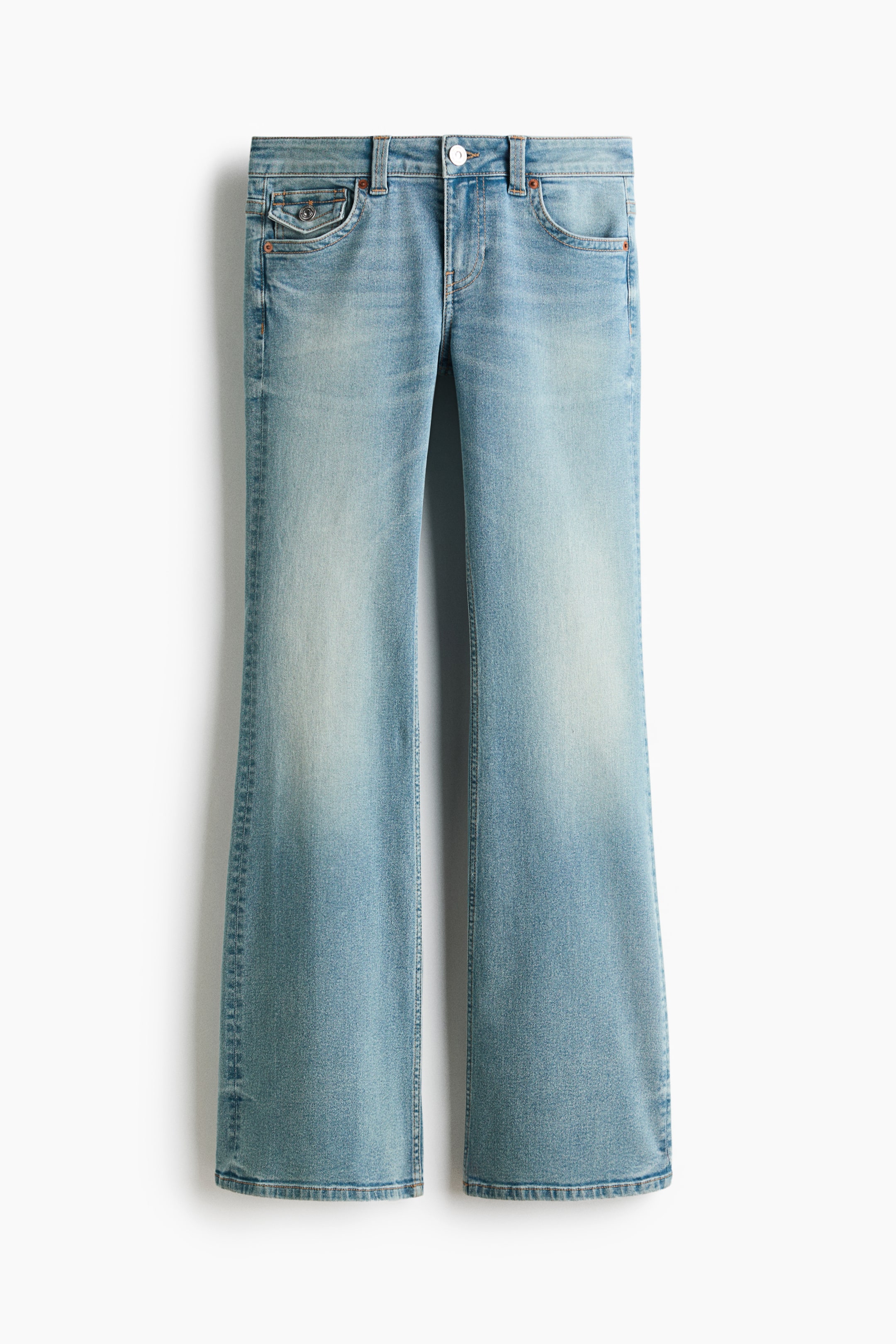 View larger image: Light blue denim flared jeans are shown from the front, featuring a low-rise waist with a zip fly and button closure, front pockets, and a coin pocket. They have a slim fit from the waist to the thigh and a flared cut from the knee to the hem.