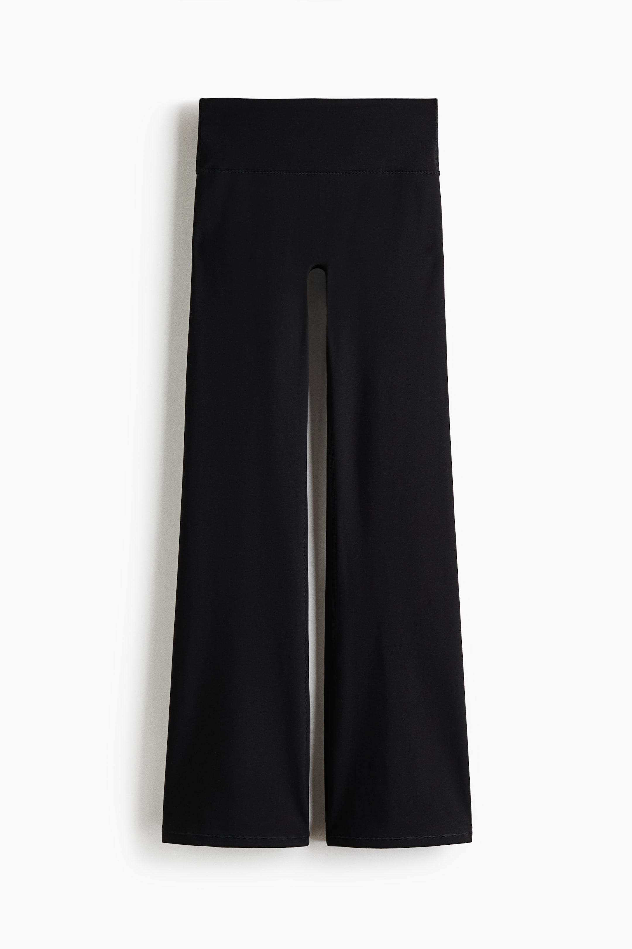 View larger image: A pair of black wide-leg pants is displayed front-facing, featuring a high, wide waistband and relaxed, straight legs.