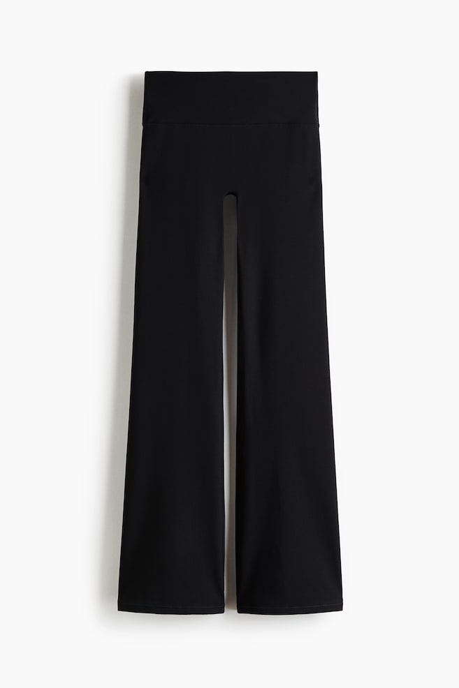 A pair of black wide-leg pants is displayed facing front, featuring a high, wide waistband and relaxed, straight legs. - 1
