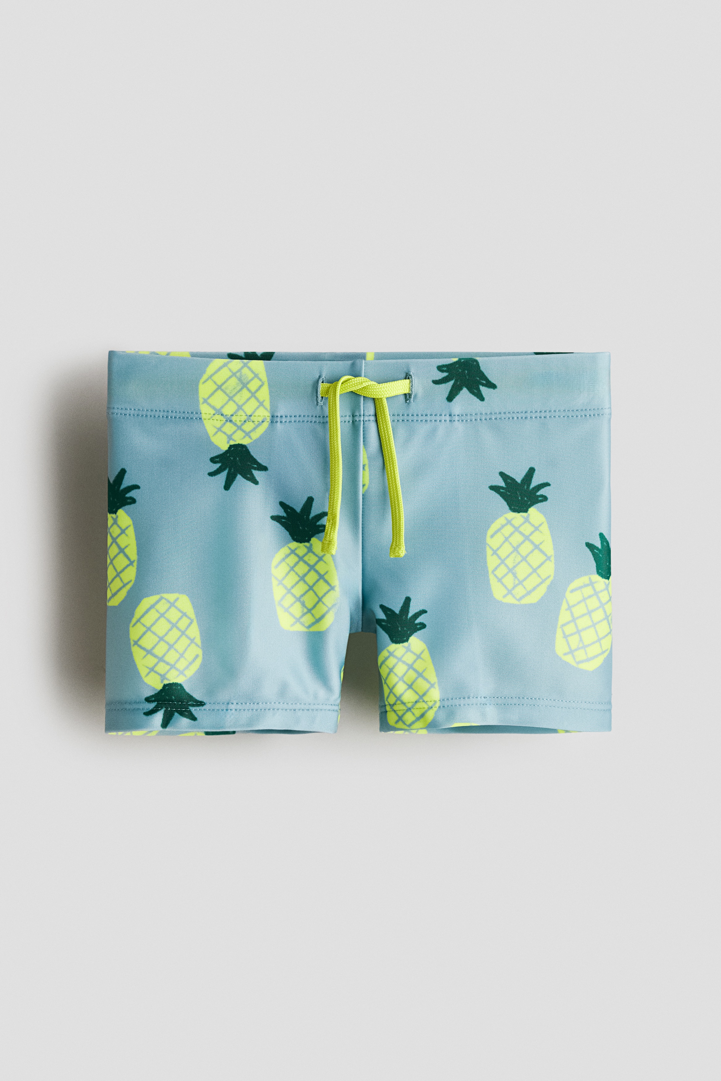 Dusty turquoise/pineapples Printed Swim Trunks for kids | H&M US