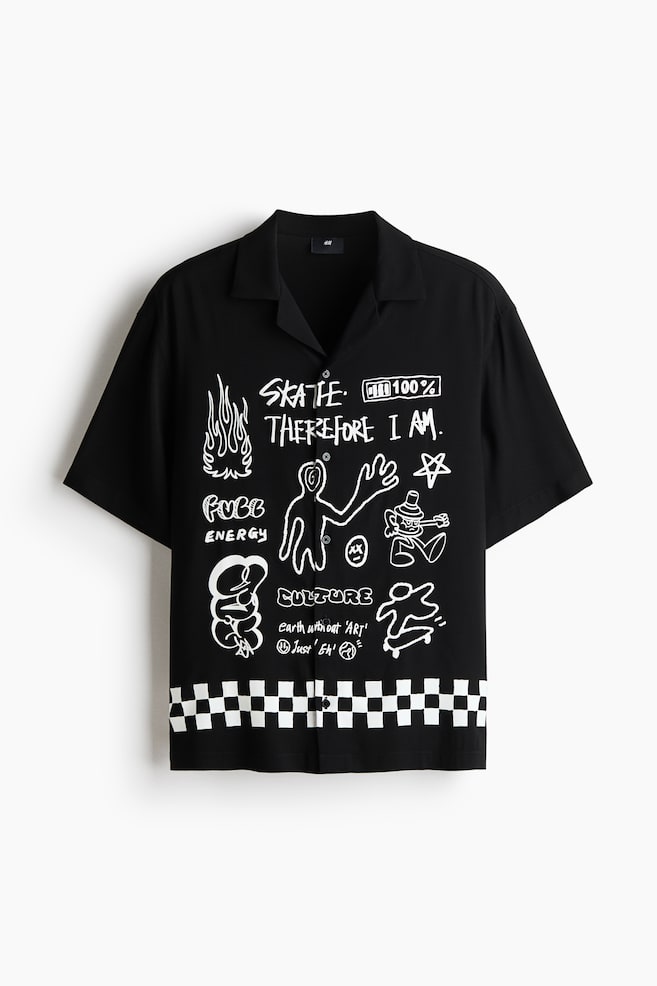 This black short-sleeved shirt showcases a revere collar and a button-up front. It boasts white, hand-drawn graphic prints featuring text and illustrations across the front, complemented by a white and black checkered pattern along the bottom hem. - 1