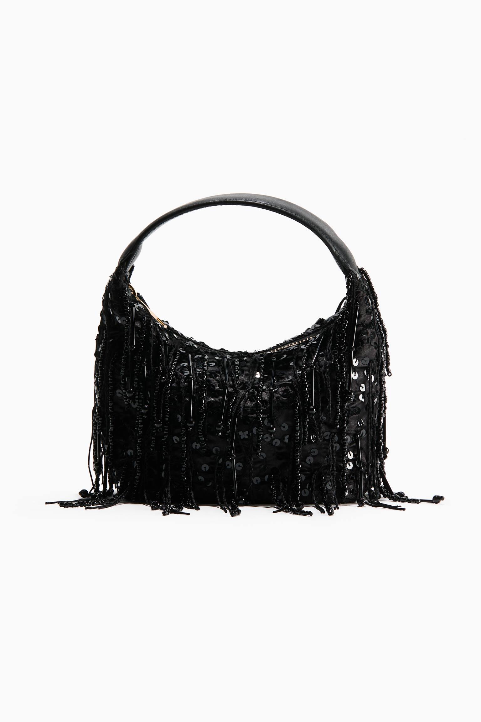 A black hobo-style shoulder bag is facing front, featuring a crescent-shaped body covered in shimmering black sequins and dangling strands of beaded fringe. A smooth, curved black shoulder strap is arching over the top of the bag.