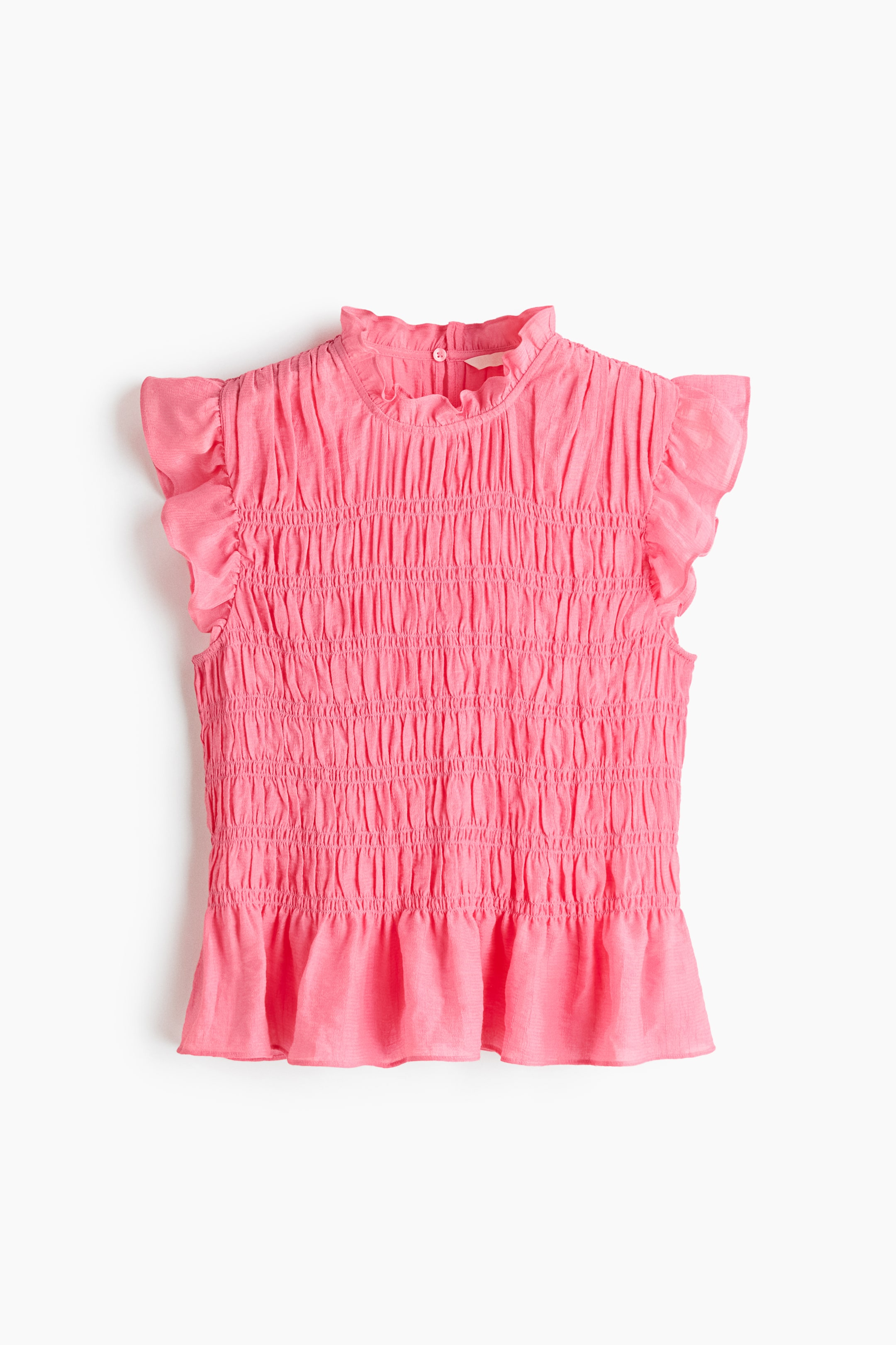 View larger image: The pink smocked peplum top showcases its front, highlighted by a high ruffled mock-neck collar with a visible button closure. It features extensive smocking across the bodice, short ruffled cap sleeves, and a flared peplum hem.