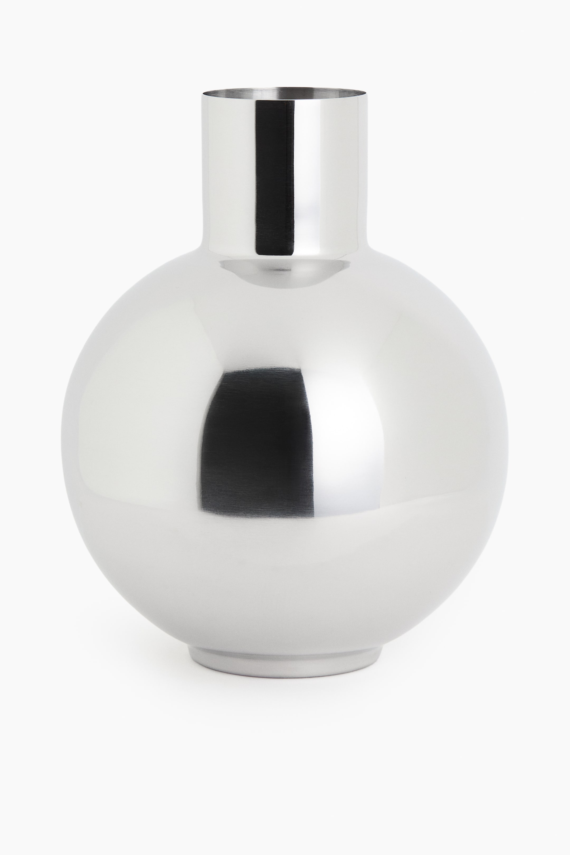 View larger image: A metallic silver vase featuring a spherical body and a narrow, cylindrical neck is resting on a flat, circular base, showcasing a highly polished finish.