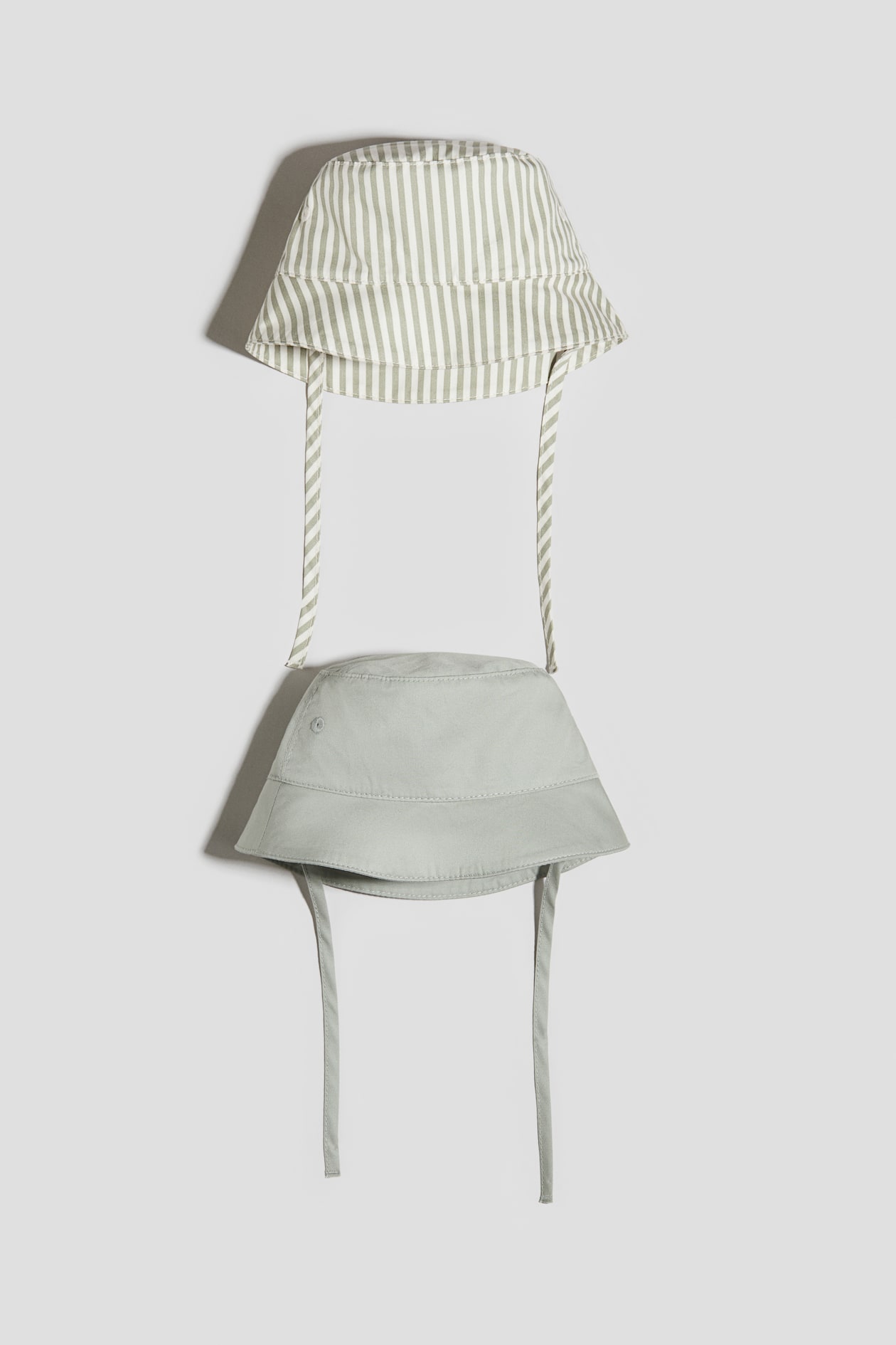 2-pack cotton sun hats - Light dusty green/Striped - Kids | H&M GB