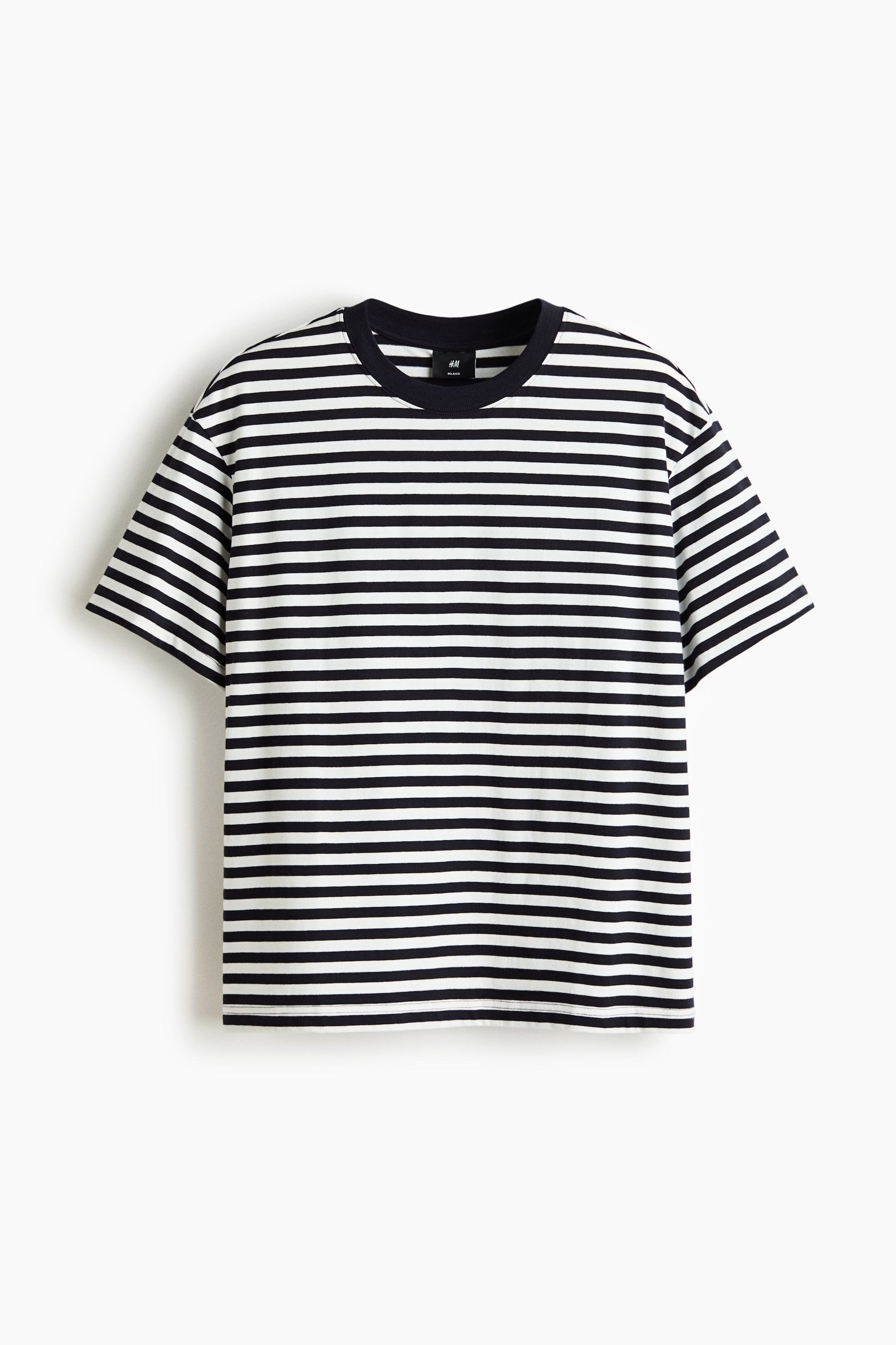 View larger image: A T-shirt is displayed from the front, showcasing black and white horizontal stripes. It features a round, ribbed neckline, dropped shoulders, and a straight-cut hem, offering a laid-back silhouette.